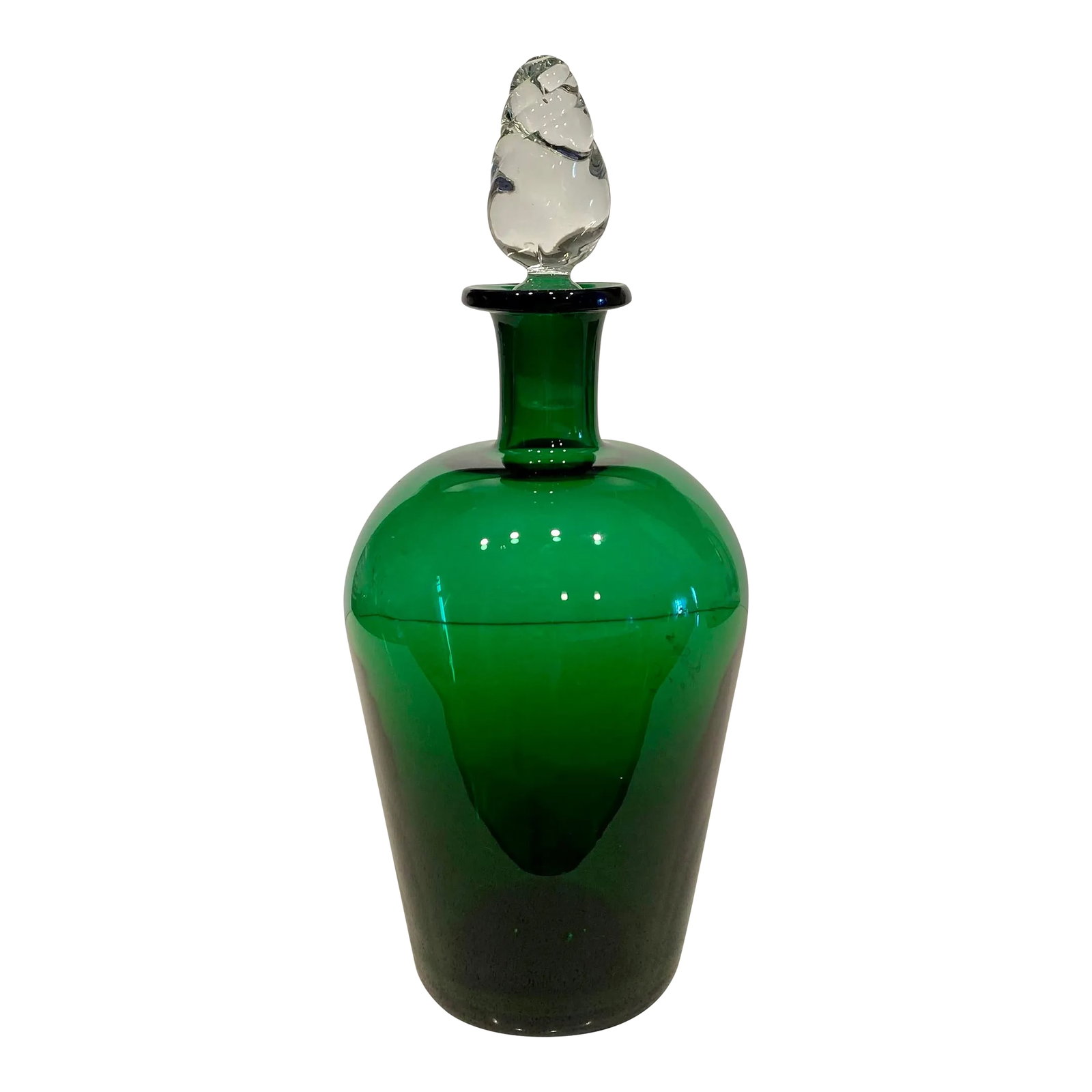 1980s Green Glass Decanter: Beautiful emerald green glass decanter with clear glass decorative stopper. This is a solid, heavy piece. Rare to find this deep jewel toned green! The stopper has a unique design which sets it apart 
