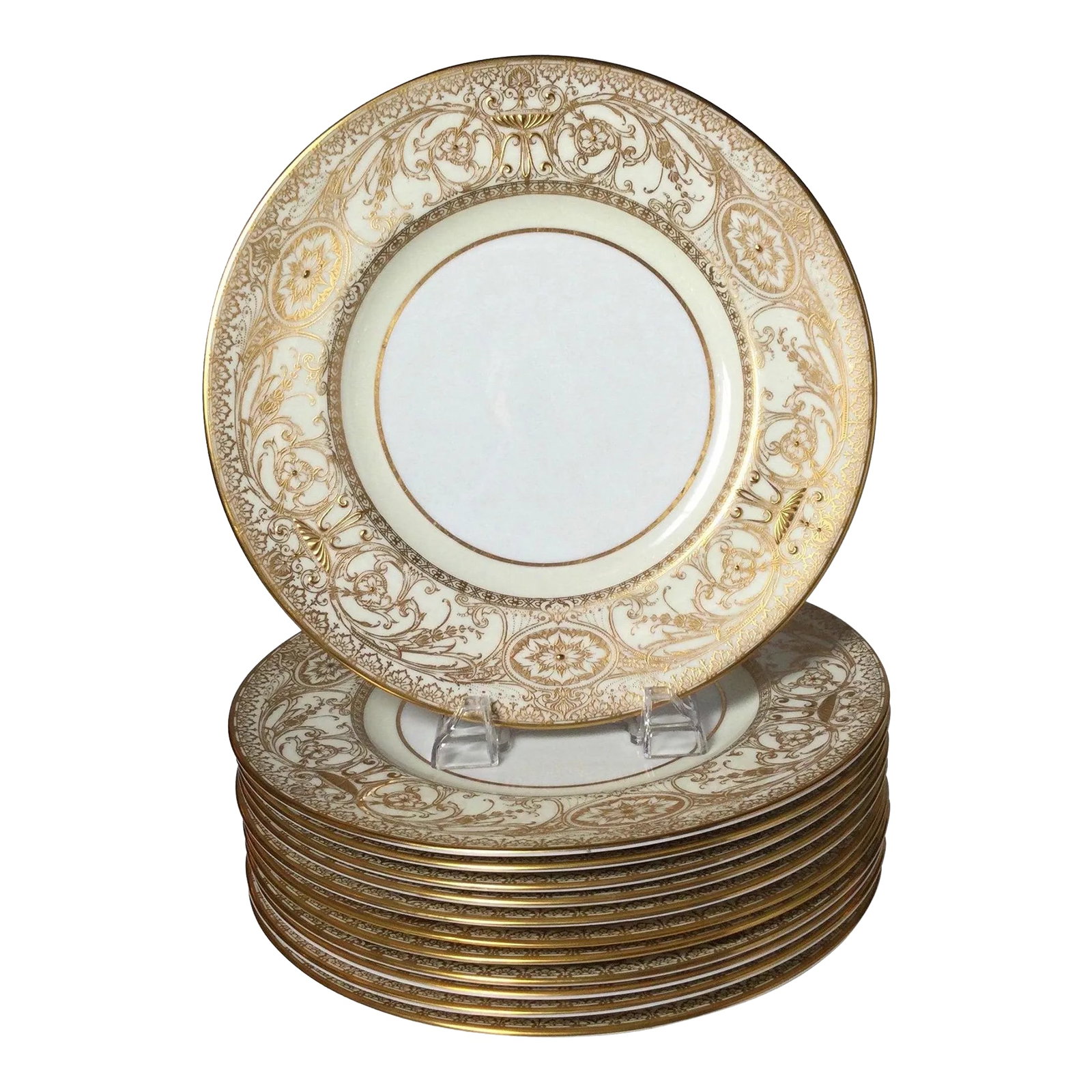 English Raised Gilt Porcelain Dinner Service Plates - Set of 12: A regal set of 12 elaborately gild service plates, by Royal Worcester. The set with delicate broad gilt borders with a white porcelain background. The mark on the back from 1950. Condition: