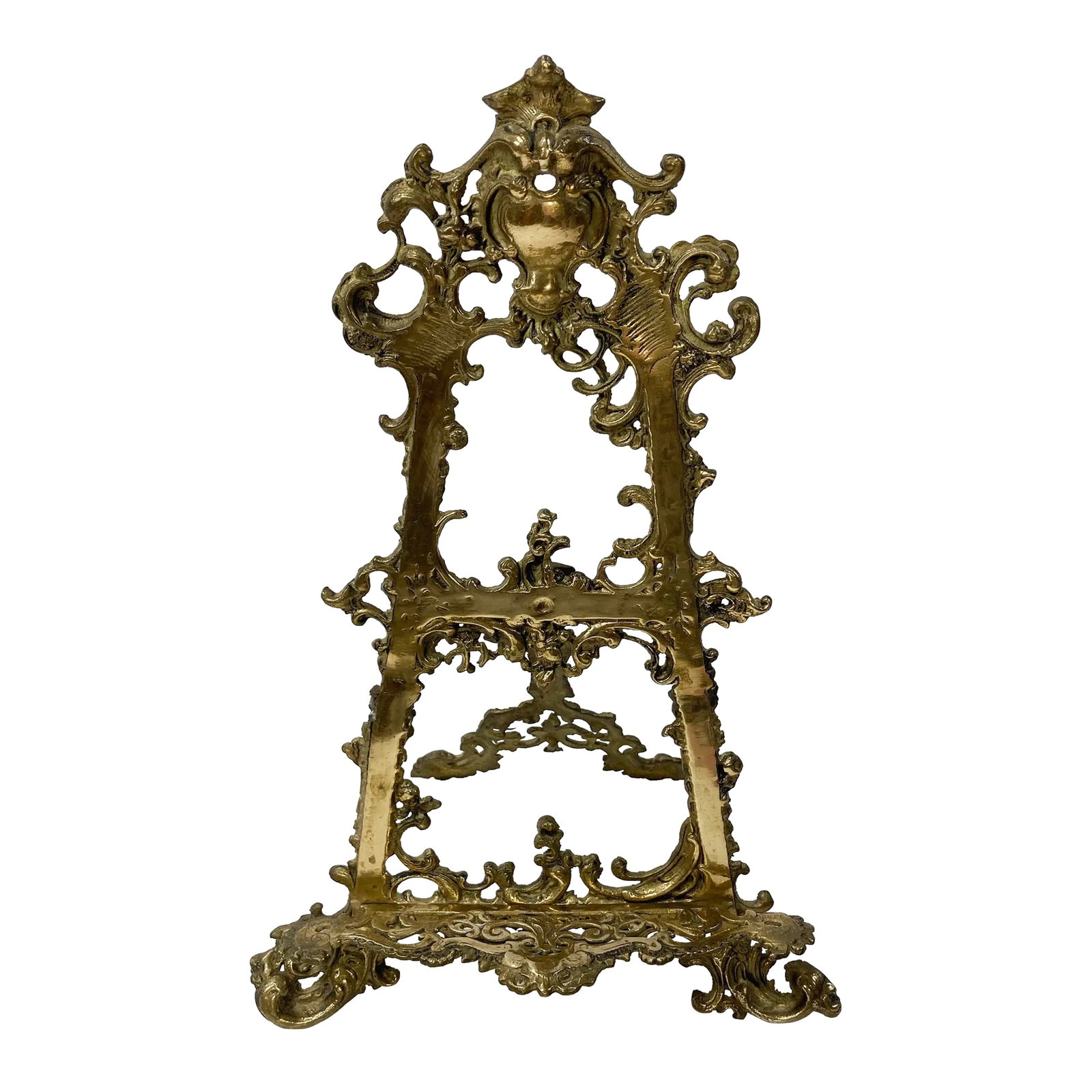 Substantial Antique Brass Victorian Style Table Easel: Stunning antique large Victorian style brass table easel featuring intricate detail to frame. Exaggerated podium makes this great for oversized art, larger books, or electronics. Heavy brass with