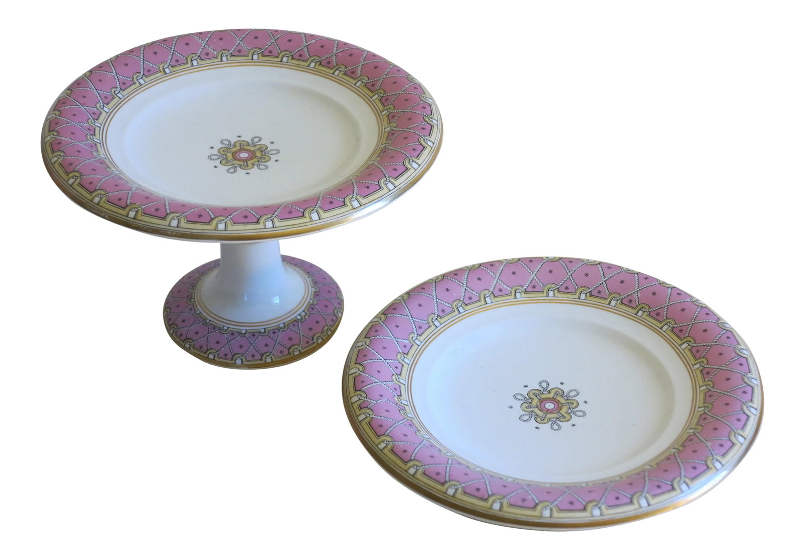 1865 Antique Wedgewood Pearlware Footed Serving Tazzas - A Pair: A stunning set of two Wedgewood Pearlware tazzas with a zigzag rope motif on a pink background. The largest piece measures 9 by 5.75 and the smaller tazza measures 9" by 2.25 high. Condition: