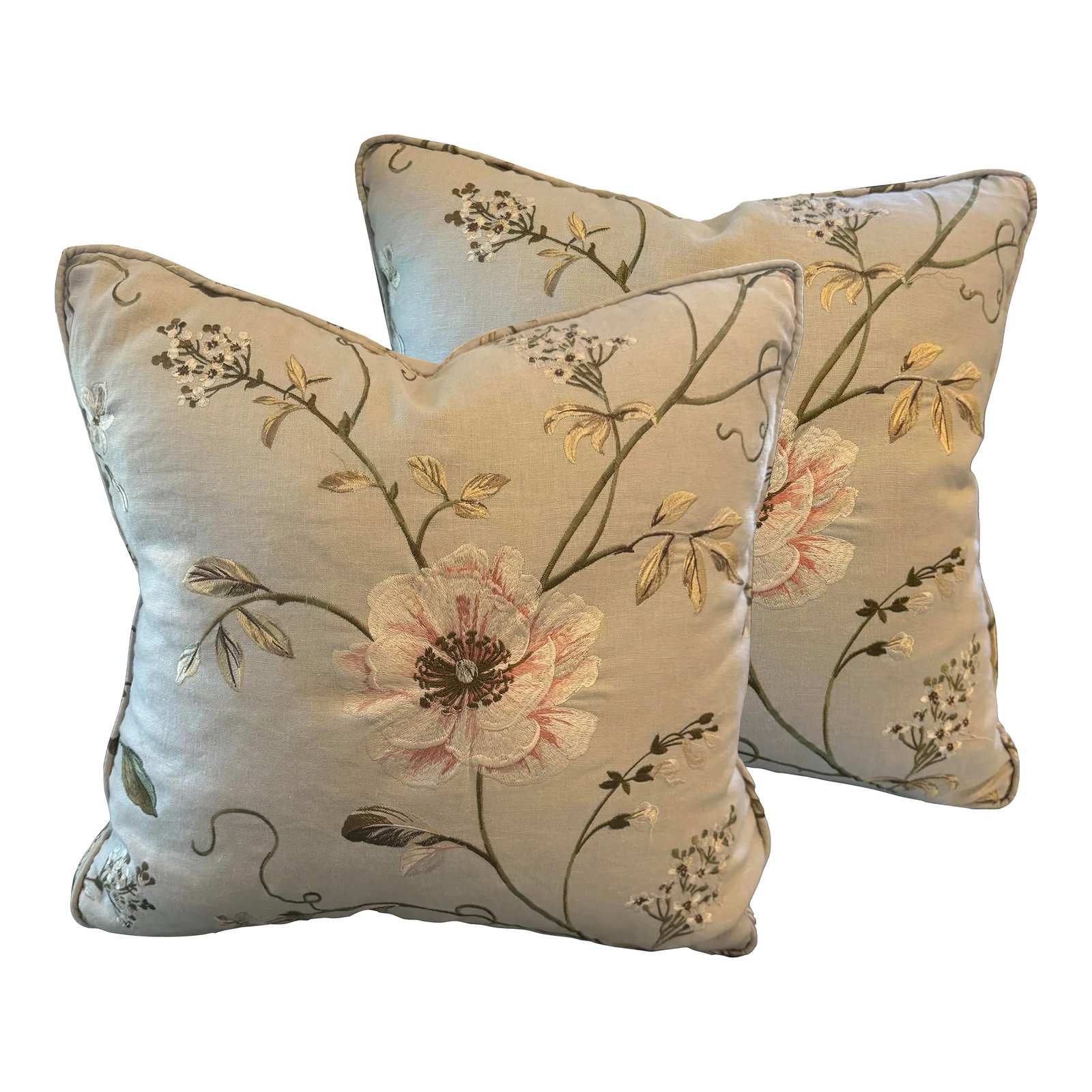 Pair of Crewel Work Embroidered Pillows: A collectable pair of crewelwork pillows with embroidered floral motifs on a soft, pale, bluish-gray linen, framed and inset with embroidered trim banding, double welt boxing, filled with plush