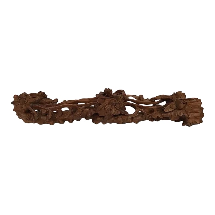 Contemporary Wood Carving of Flowers in the Shape of a Ruyi: This is a contemporary wood carving that is expertly done. Like the ruyi, the design is centered in three places, the ends and the middle. Through the use of modern tools, the carver could make
