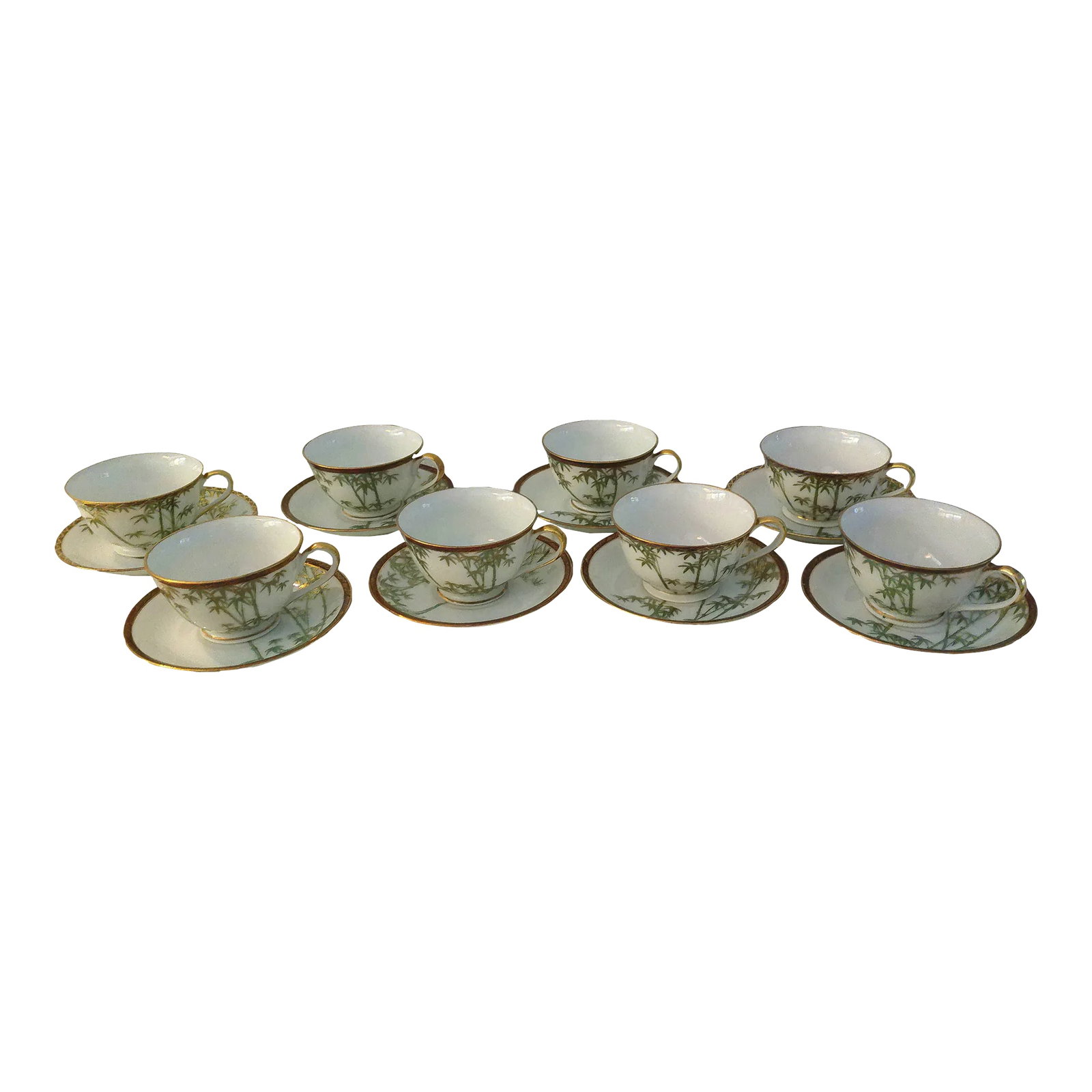 1970s Soko Bone China Bamboo Cups & Saucers, Srvc. For 8: Lovely set of eight Japanese Soko Bone China cups, (4.75"L x 3.75"W x 2.25"H), and saucers, (6"Dia x 1"H), featuring a bamboo design in Emerald green with gold accents. Rim of cup and saucer feature