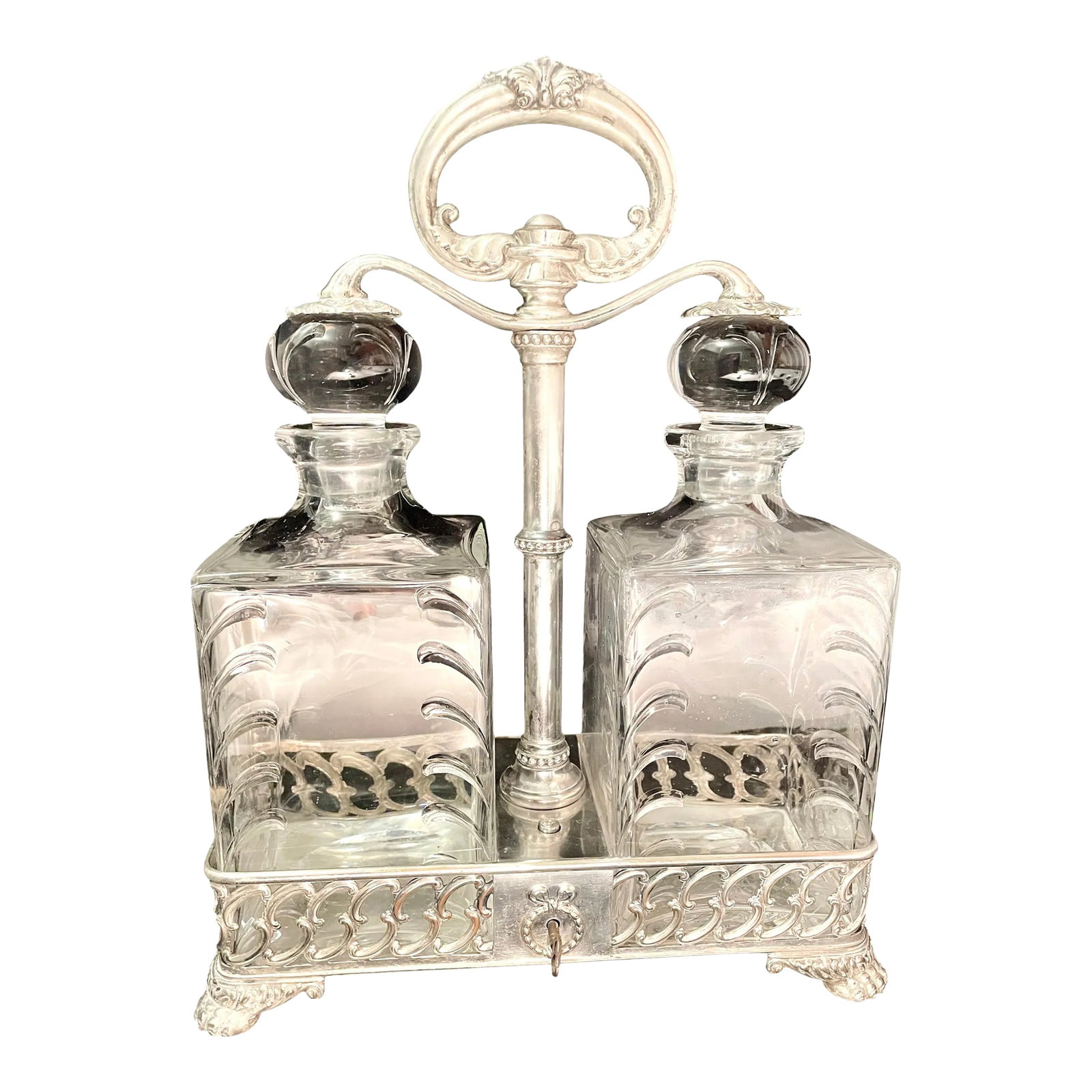 1890s Tiffany and Co. Gilded Age Monogrammed Tantalus With Baccarat Decanters, Original Key: This is a spectacular Tiffany & Company silver-plated tantalus from a Mainline Philadelphia estate. It features a beautiful three-letter monogram hand-engraved by Tiffany studios and is accompanied