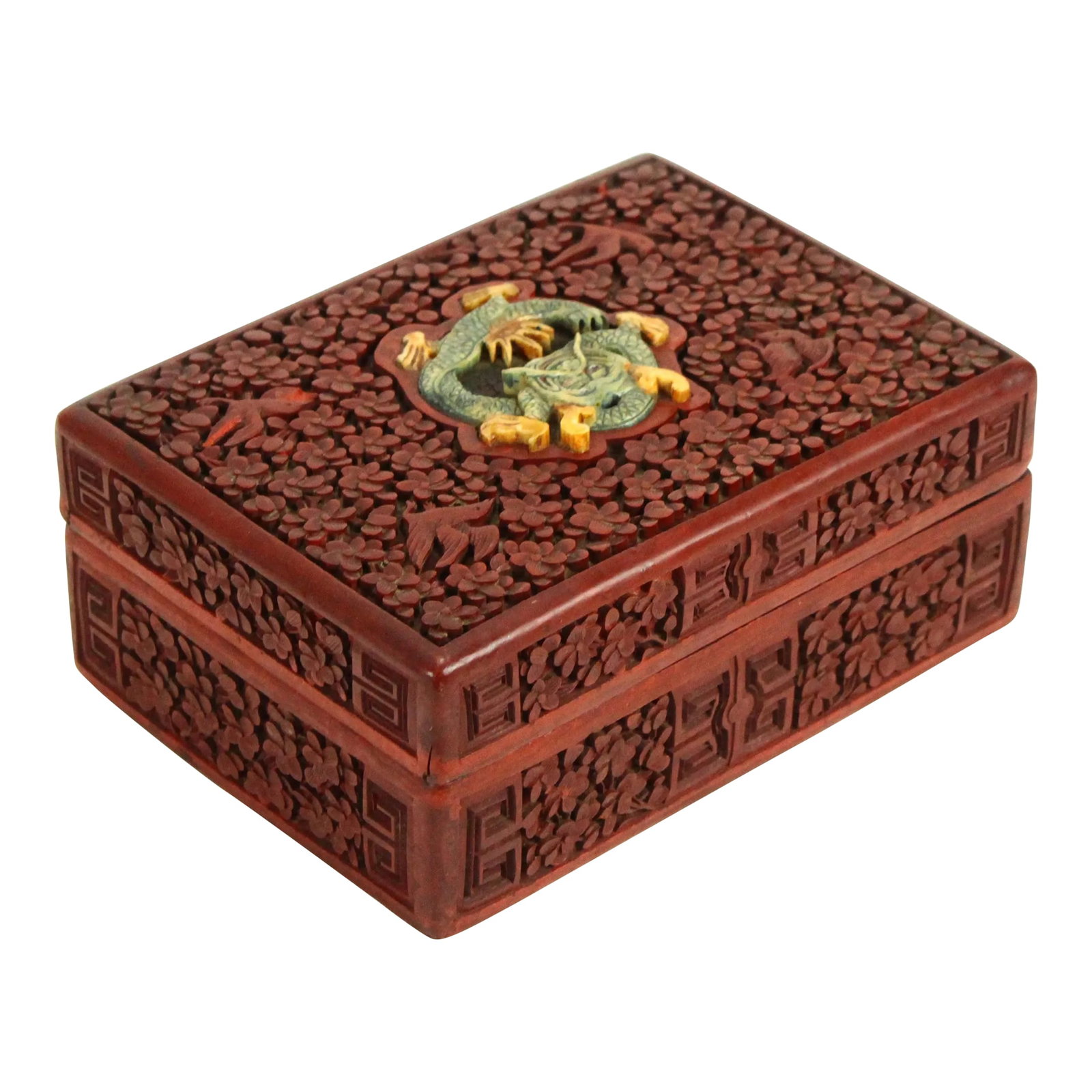 Late 19th Century Chinese Red Cinnabar Box With Carved Stone Dragon: An outstanding antique box Hand carved dark red cinnabar over lacquered wood with meticulously rendered oriental floral ornaments Masterly carved dragon up top Exquisite detail of the decorations all