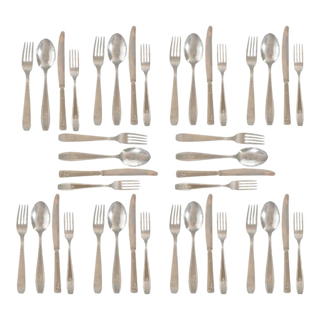 Mid 20th Century Maritime Flatware With Anchors, Service for Ten: Offering a service for ten, this silverware set brings elegance to the table with its subtle maritime emblems. The collection has a gentle patina that only authentic vintage silver-plate can provide.
