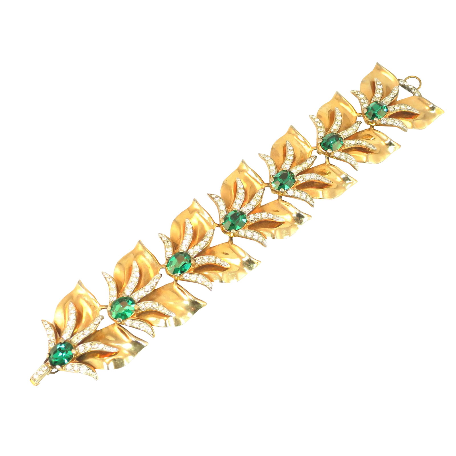 Vintage 1940s Mid-Century Modern Emerald Crystal Link Bracelet: This is part of Chairish's Costume Jewelry assortment. Offered here is a massive Mid-Century Modern abstract gold-plated emerald crystal bracelet from the 1940s. The construction consists of seven