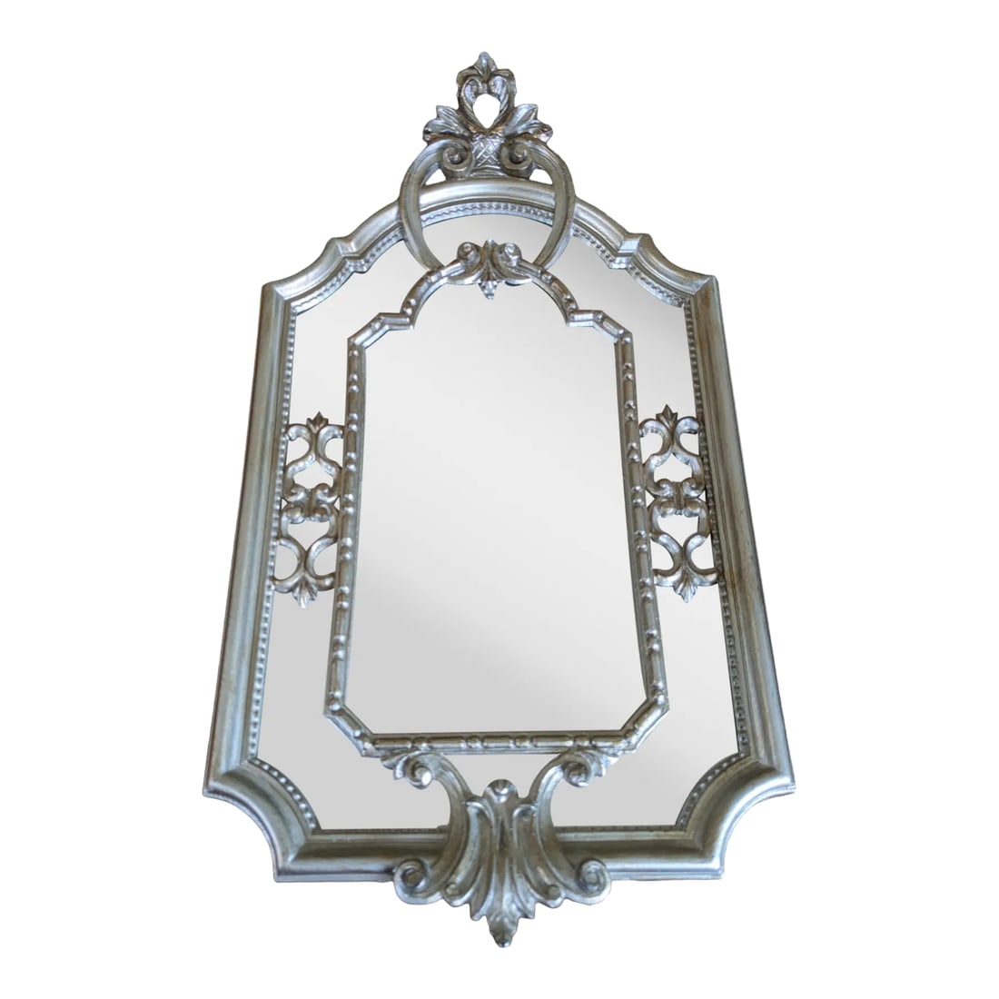 Vintage Italian Hollywood Regency Style Mirror: The Italians do many things well ... and mirrors is one of them. Case in point, this Italian Hollywood Regency style mirror with ornate, silver-tone wood frame. This vintage mirror features intricate