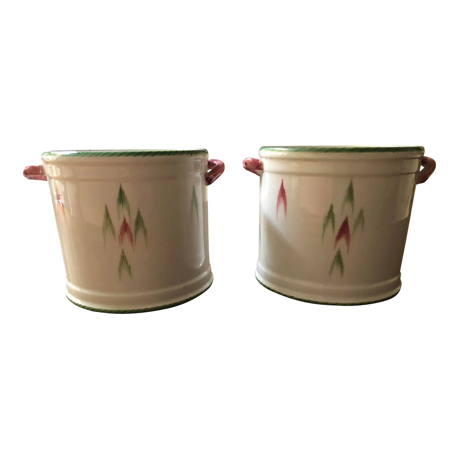 Pair of Late 20th Century Italian Este Ceramiche Faience Cachepots 1970: Pair of simple white earthenware cachepots hand-painted with pink and green design and pink handles. Top edge painted with pale green hatchmark pattern. Made by famous Este Ceramiche pottery maker.