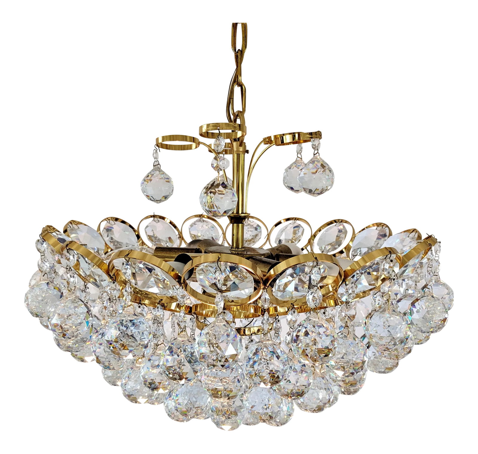 1970s Crystal and Gilt Brass Chandelier by J. L. Lobmeyr: Jeweled hand-cut crystal and gold plated brass chandelier by J. L. Lobmeyr. Circa 1960. The Chandelier has a tier of brass circles with scalloped type faceted crystal inserts and has a circular
