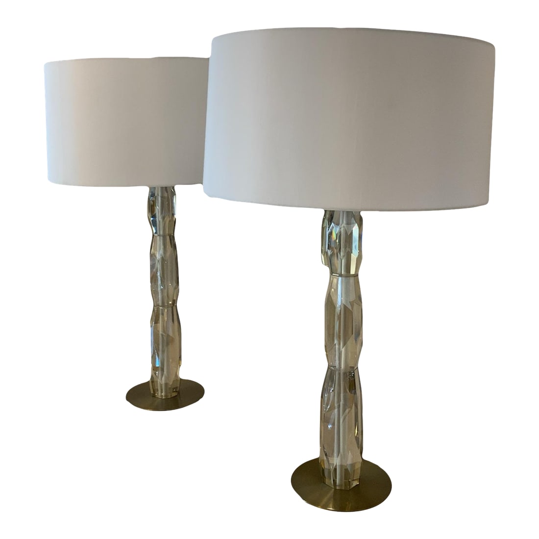 Pair of Multifaceted Lamps: Add a touch of elegance and modernity to your space with this pair of gorgeous multifaceted lamps. Their sleek and versatile appearance makes them perfect for enhancing any room, from living areas to