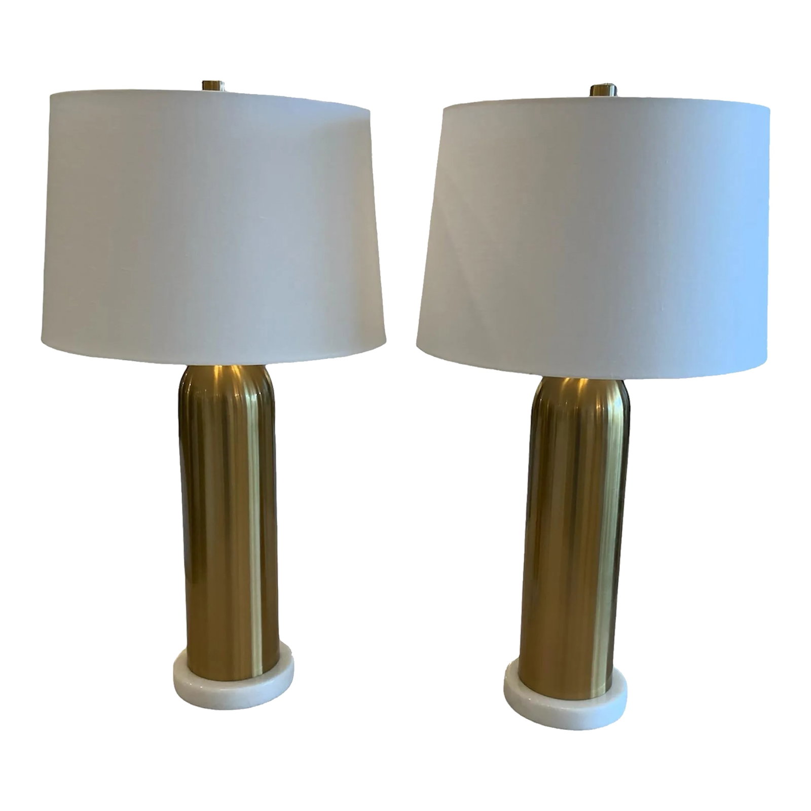 Pair of Elishaw Lamps: Modern glam style meets sleek midcentury design in the Elishaw Table Lamp. This metal design features a luxe aged brass finish and sits on a white marble base. Perfect for accenting a living room