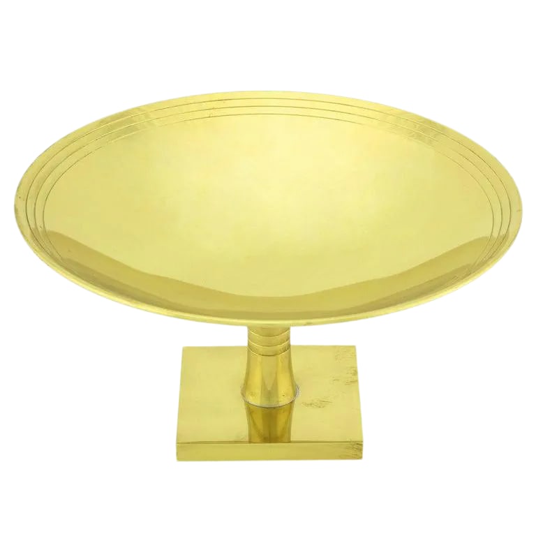 Tommi Parzinger for Dorlyn Brass Footed Compote.: Brass plated brass footed compote by Tommi Parzinger for Dorlyn-Silversmiths. Square pedestal base with a three ring incised stem and shallow bowl with three incised rings and a delicate turned lip.