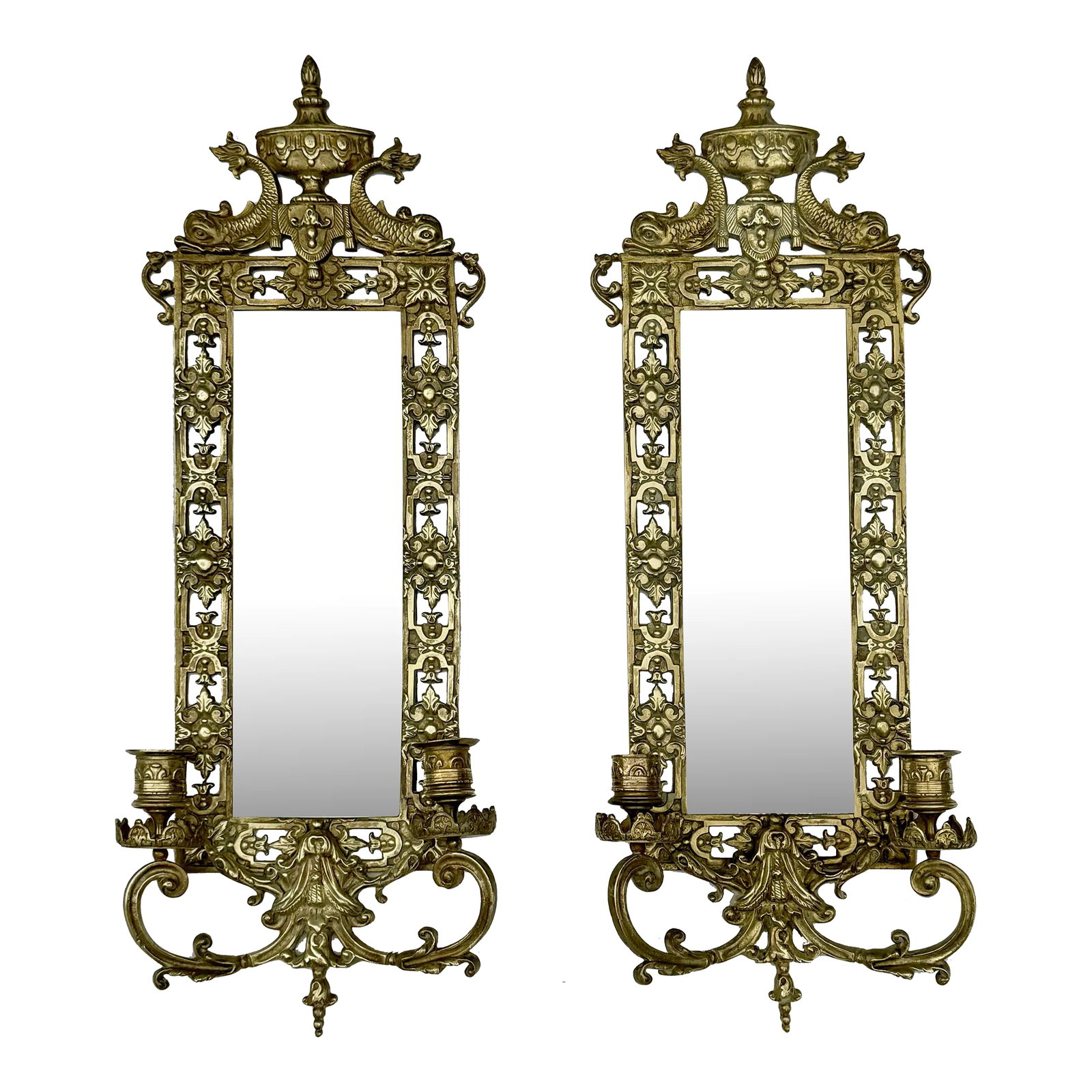 Pair of Mid 19th Century Renaissance Revival Brass Wall Sconce Mirrors: Pair Renaissance Revival Brass Wall Sconce Mirrors with urn at top flanked by dolphins above cast and pierced acanthus frame with two candle holders at lower body. This antique pair of bronze sconces