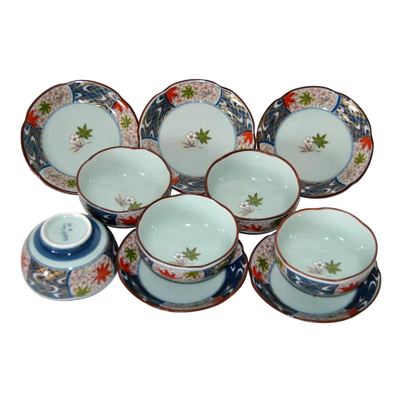 Authentic Arita Imari Celadon Cherry Blossom Shaped Cups and Saucers- 10 Pieces: Unique Japanese Arita-Imari five-cup and saucer set, Celadon Porcelain, with Display Cabinet in Lacquered Wood. These Cherry Blossom (ume) shaped cups are used in Japanese Tea-Houses. Saucers are