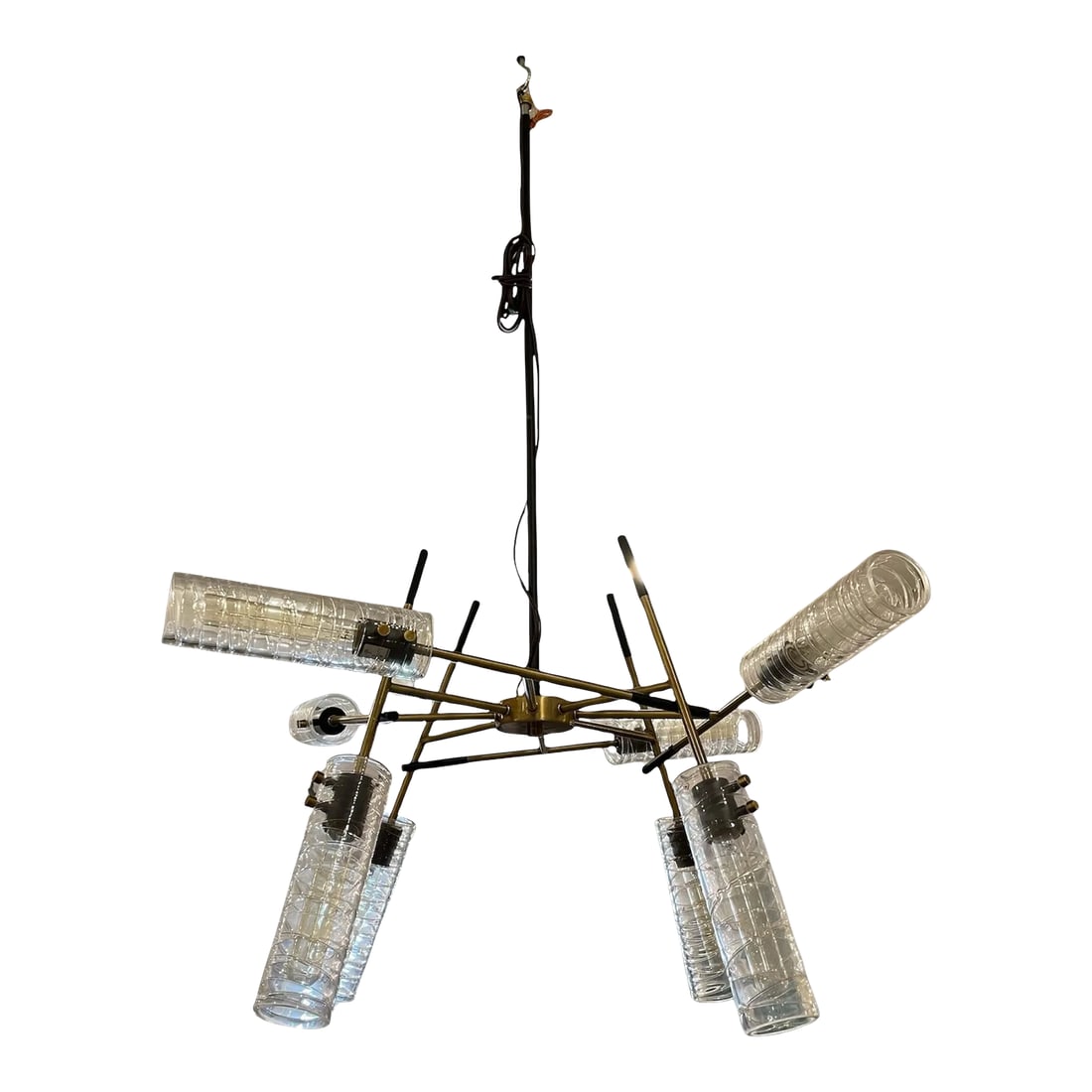 Telesto Chandelier in Brass Finish: A dramatic soft contemporary look blends straight lines and linear glass to give us this eye-catching 8 Lt. pendant. Featuring a combination finish of texture black and antique brass complementing