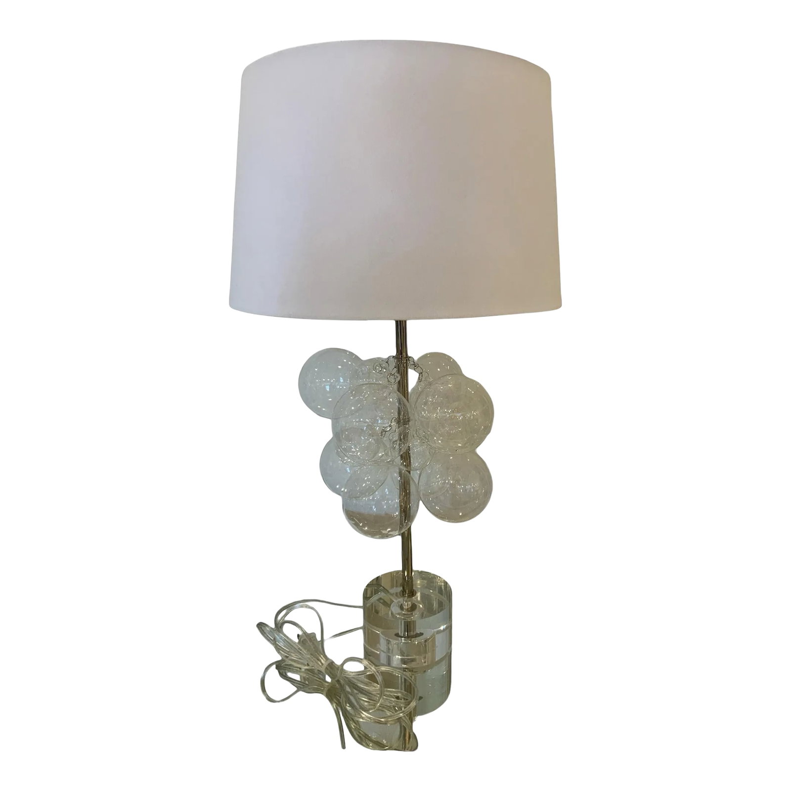 Clear Bubble Lamp: Float away with the Bubbles Table Lamp. Clear glass spheres adorn a thin polished nickel rod base, and the crystal pedestal sets the whole piece off luxuriously. Show off your fun side by installing