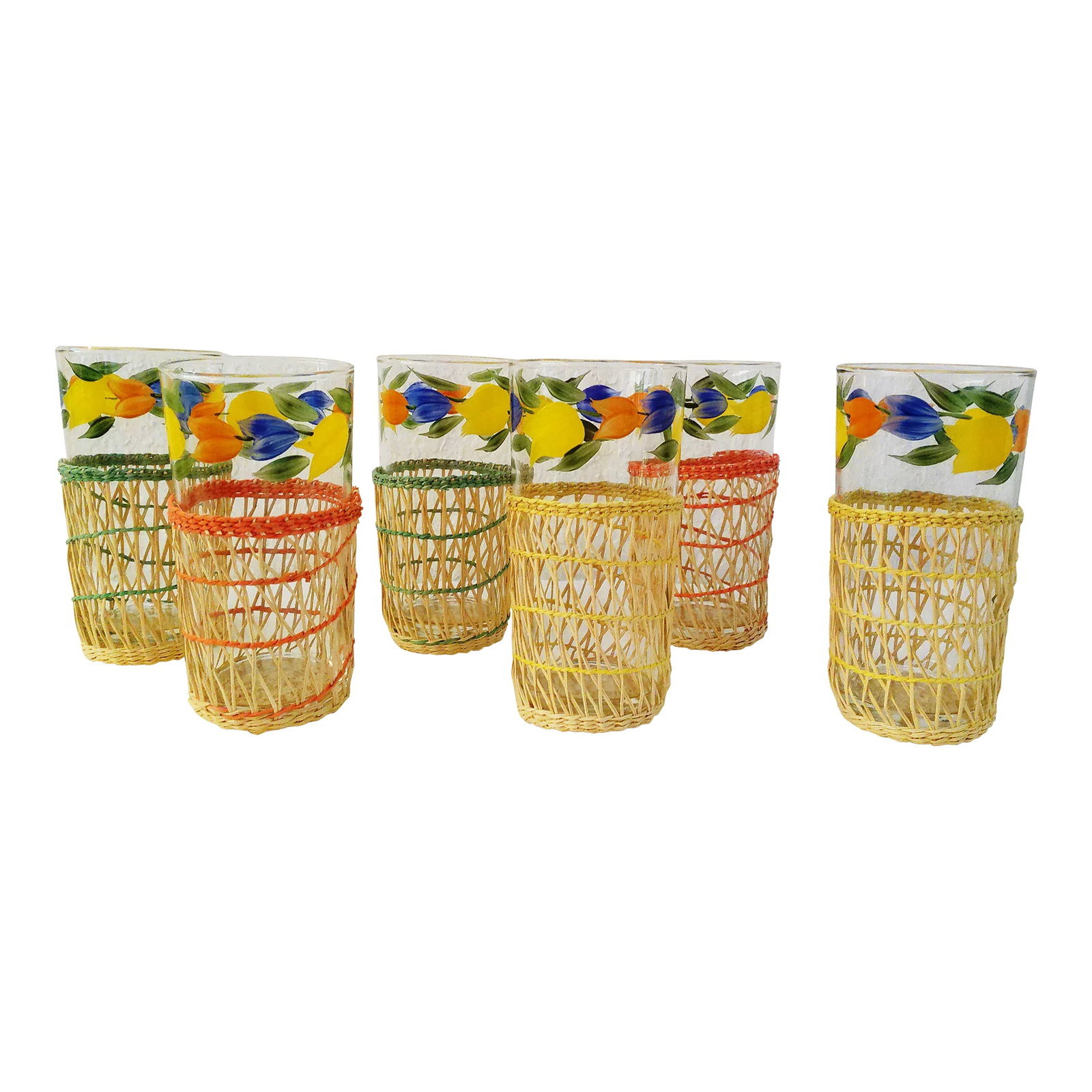 Vintage Floral Glass Tumblers W/Caddy, Set of 6: Sweet set of six vintage clear glass tumblers featuring a colorful floral design around top perimeter of glass with gold rims. Complimented with six removable wicker holders consisting of two each of
