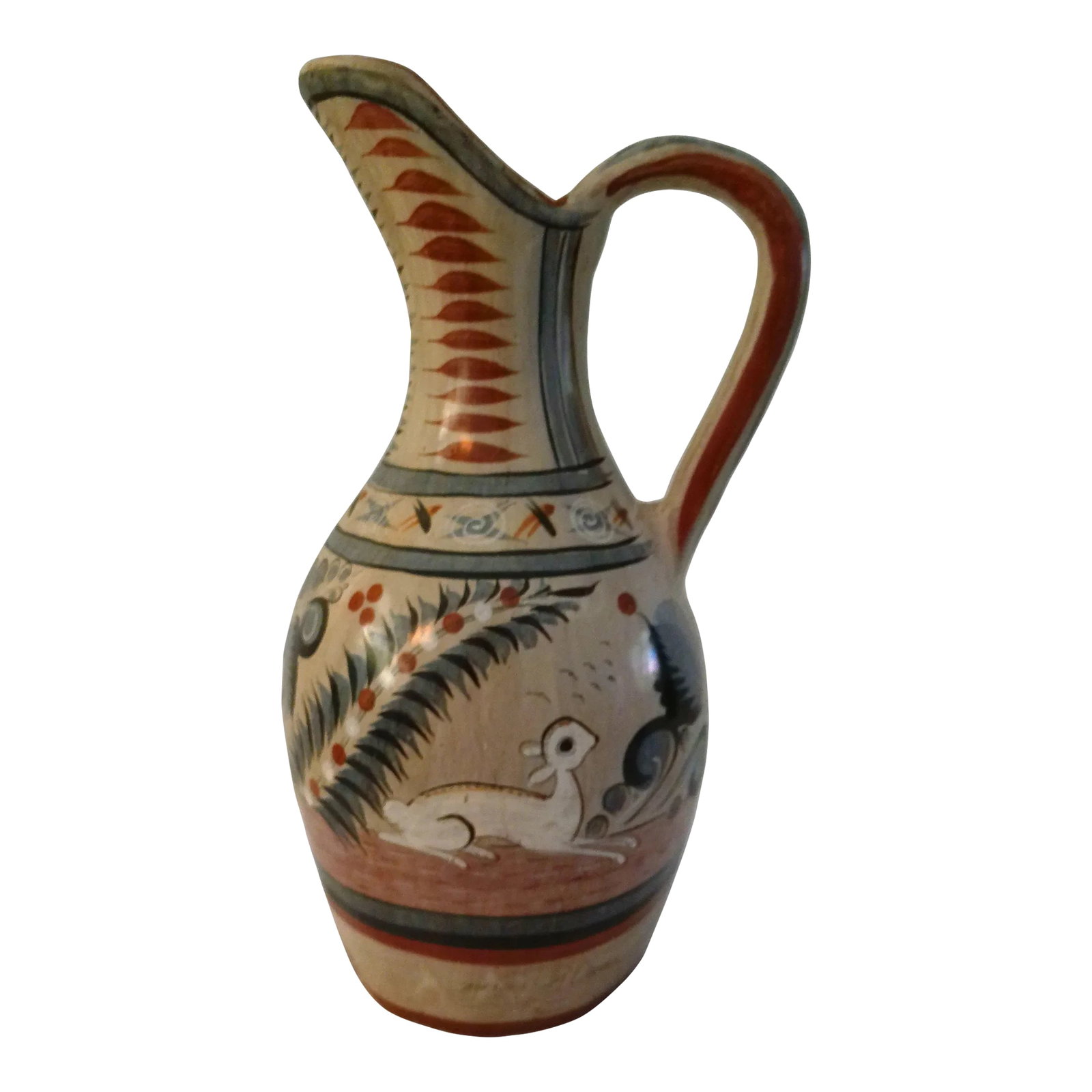 Mid-Century Large Mexican Artisinal Tonala Pottery Water Pitcher: Large mid-century hand-made Mexican folk art Tonala pottery handled water pitcher featuring a traditional hand-painted design around perimeter. Artist signed "Mexico P. Olvera." For decorative use onl