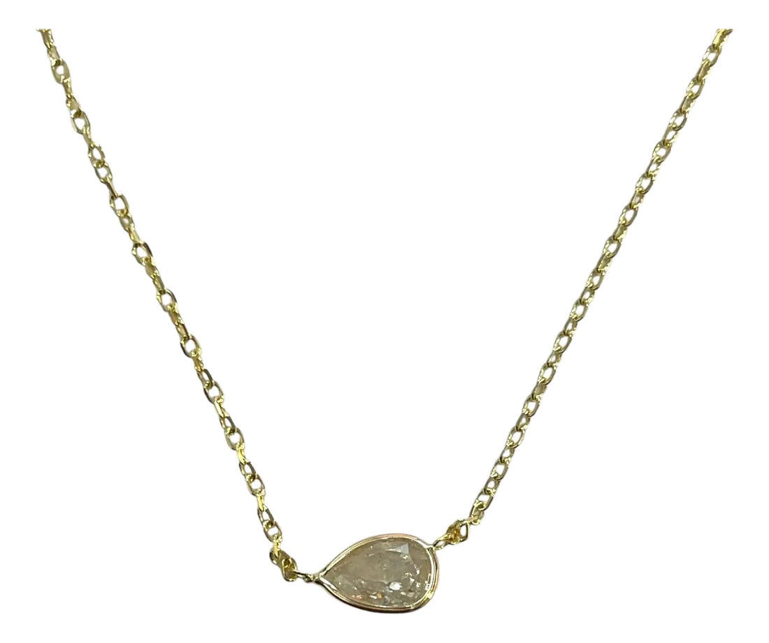 Radiant 14k Yellow Gold 0.73ct Pear Natural Diamond Bezeled Necklace: A delicate marvel, this necklace features a 0.73ct natural pear diamond bezel-set in radiant 14K yellow gold. The adjustable chain adds versatility to this elegant piece, perfect for day or night.