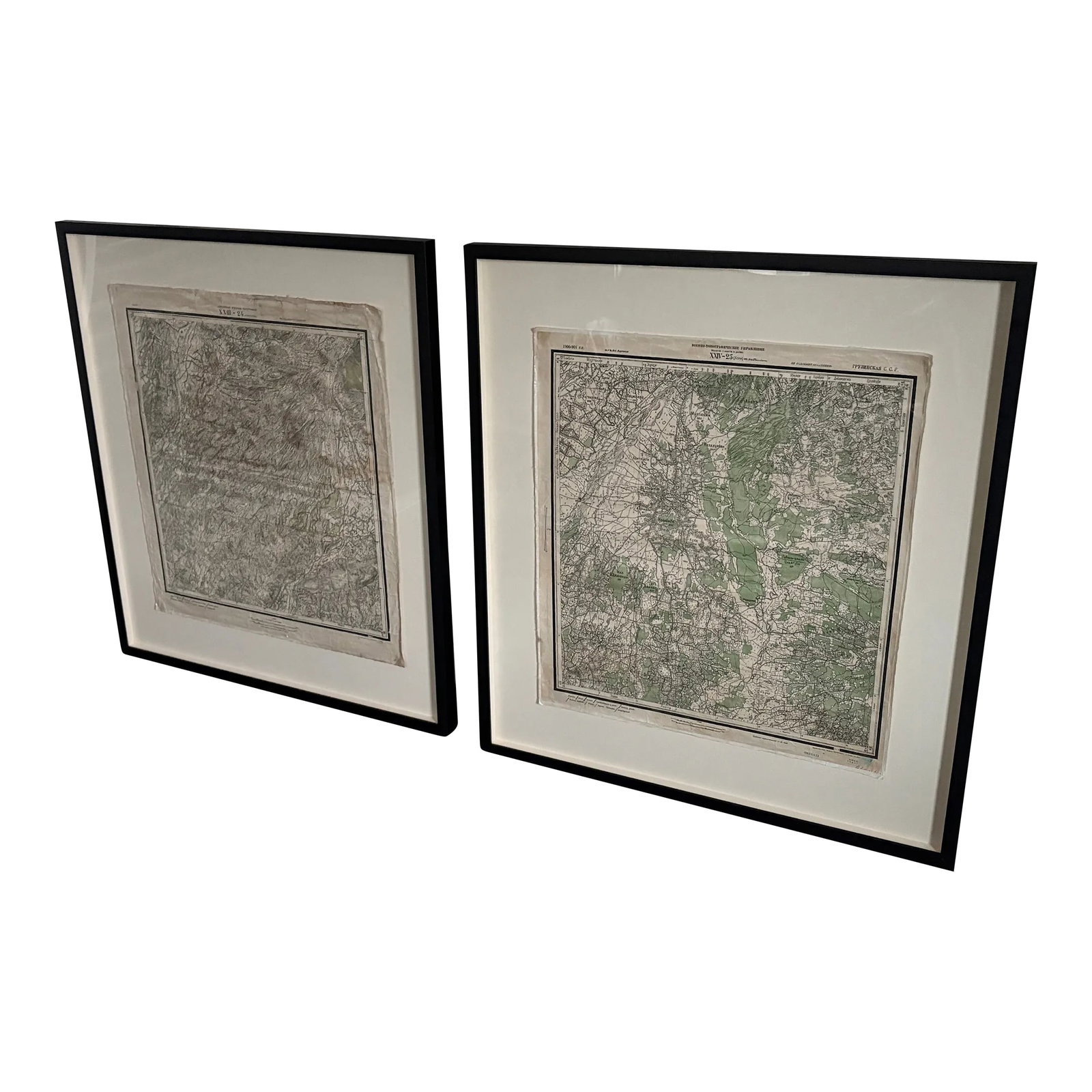 Pair of Mounted Russian Submarine Maps: Pair of Russian submarine maps mounted on linen and framed in black wood. Originally created by Blackman Cruz in Los Angeles. Condition: Alterations: Original Condition Unaltered Imperfections: Some