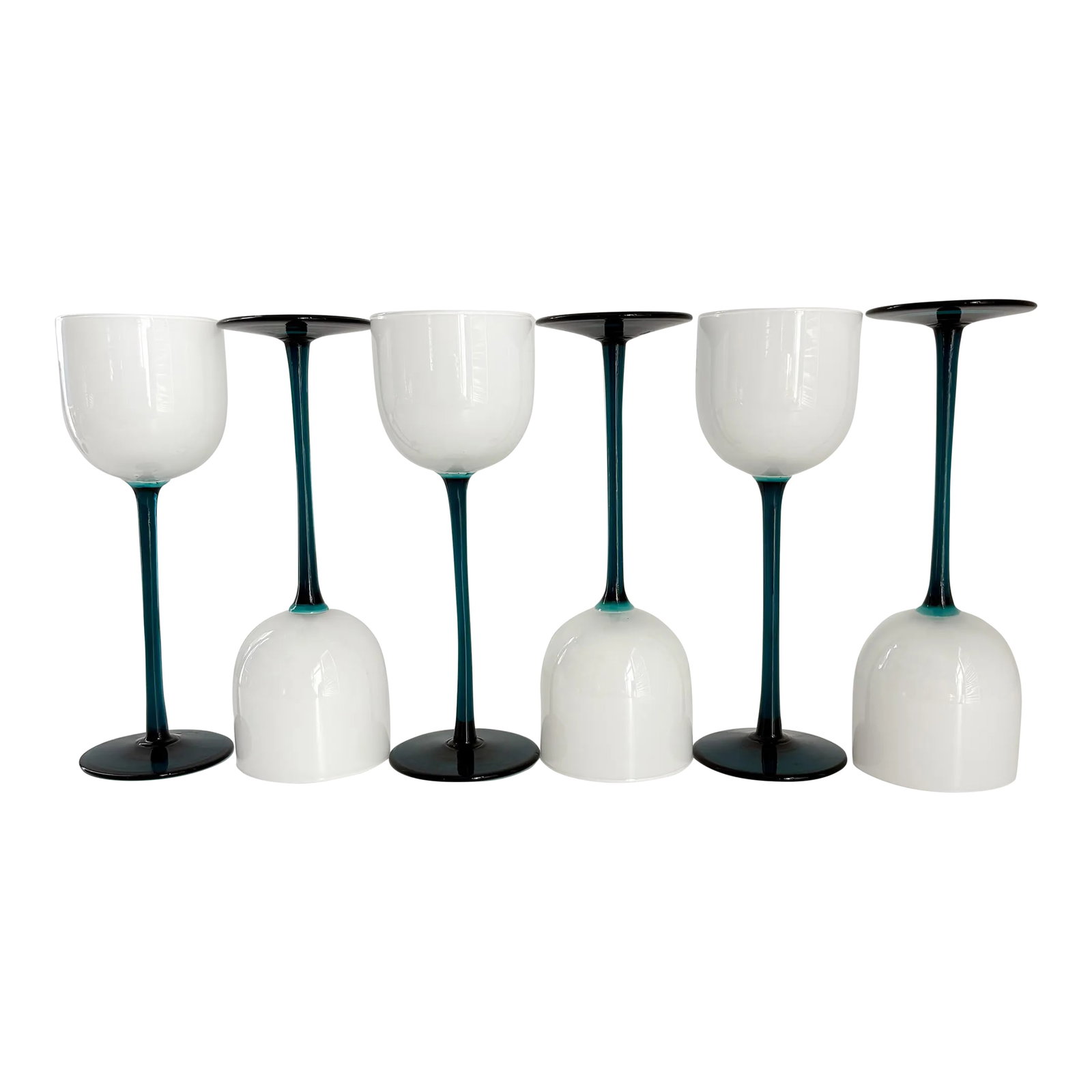 1960s Carlo Moretti Empoli Cased Teal Stemmed Wine Glasses- Set of 6: This beautiful set of teal hued stem Empoli cased wine glasses are unusually tall and create a sculptural aesthetic on any tabletop they stand! Features a milk glass goblet with a transparent teal