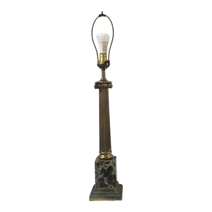 Mid 20th Century Brass & Marble Ionic Column Lamp: Stunning midcentury table lamp in the shape of a fluted Ionic column. Featuring a brass body and base accented with black Italian portoro marble. Elegant and timeless piece of statement lighting. Wond