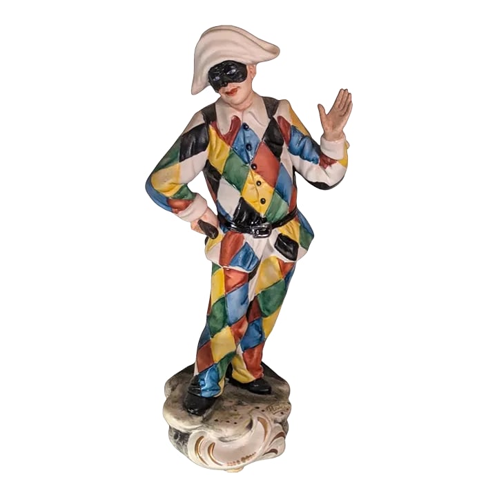 "Masked Jester" in Capodimonte Porcelain Signed "La Medea by Rori" Napoli Italy 1960-1970s: Rare hand painted Capodimonte porcellane (sic. porcelain) effigy of an old world Italian Royal Court Jester "Arlecchino" wearing a harlequin costume and black carnival mask. The figurine's suit is