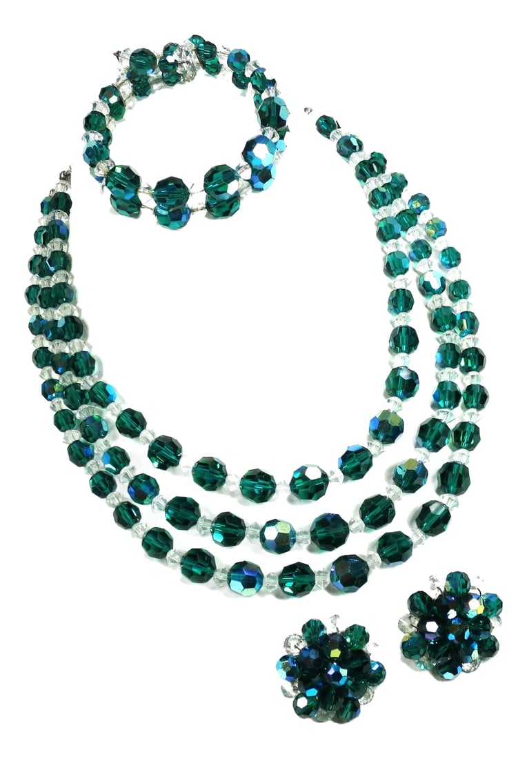 Vintage 1950s Emerald Crystal Beaded Necklace Set - 4 Pieces: 1950s crystal necklace, bracelet, clip-back earrings. Three-strand necklace, two-row memory wire bracelet, and button earrings, of round emerald crystal beads alternating w/ smaller clears, w/ silver-