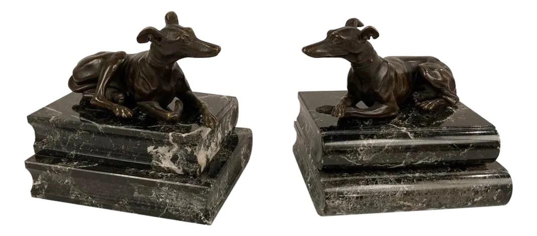 Pair of Regency Bronze Figures of Reclining Whippets on Green Marble Bases: Pair of English Regency bronze whippets or greyhounds on verdi antico marble book form bases, after a model by Thomas Weeks. Each dog sculpture is beautifully cast with their individual