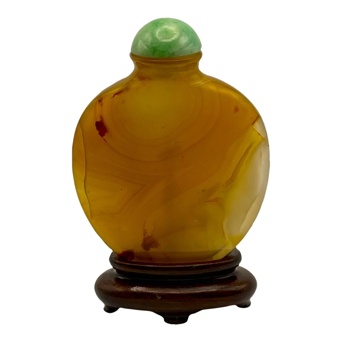 19th Century Hollow Agate Snuff Bottle on a Wood Stand: The object is of oval-shaped, well-hollowed chalcedony with a flared neck is a fine example of Qing Dynasty craftsmanship, probably late 18th to early 19th century. The deep rich amber color