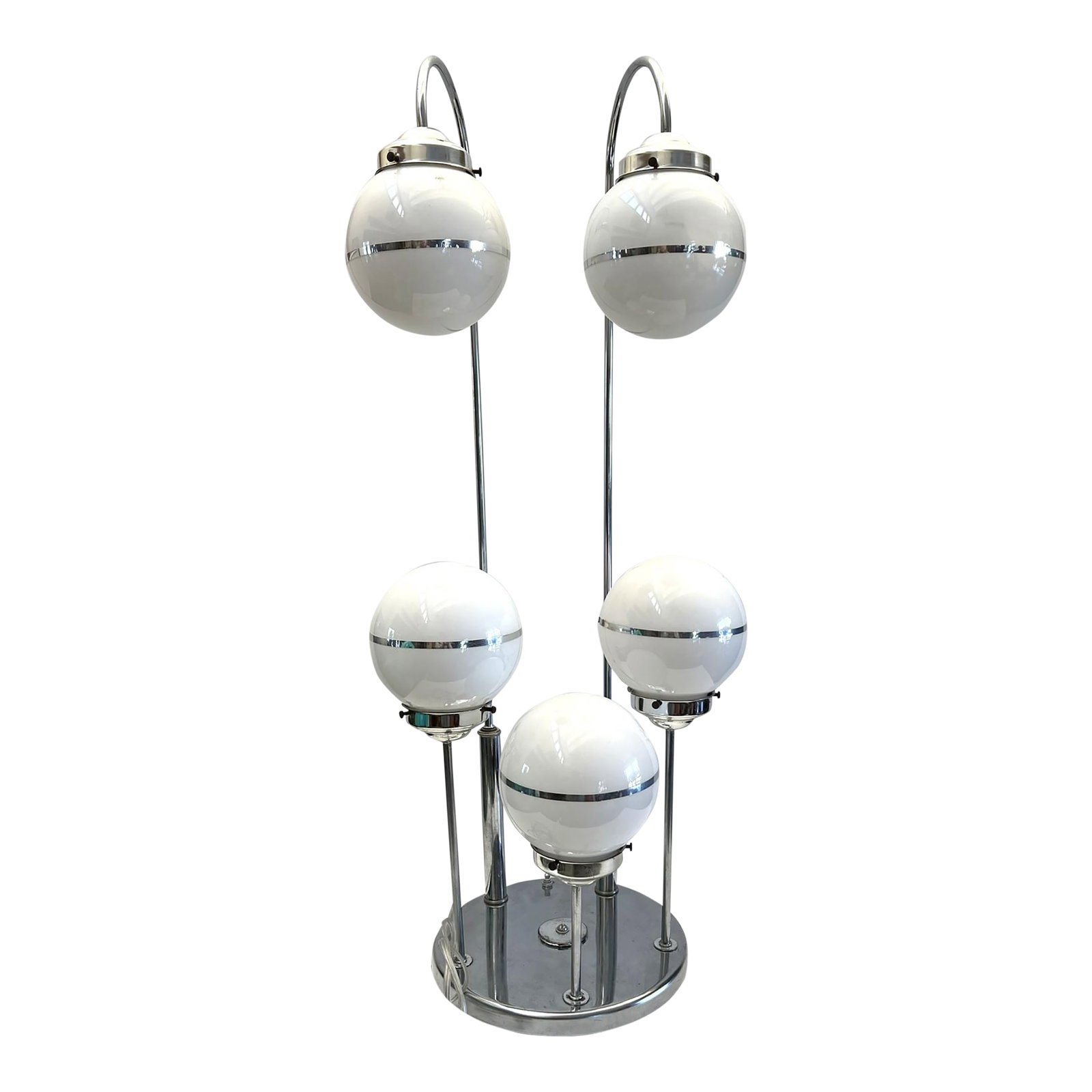 Mid-Century Modern Table Lamp With Globe Shades: The mid-century modern table lamp with globe-shaped shades on a chrome base speaks of clean lines, minimal aesthetics and elegance of the mid-century modern period, 1950s - 1970s. The lamp that is so 