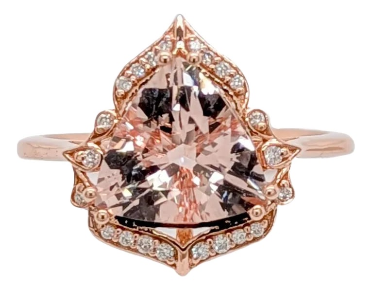 2 Carat Morganite Ring W Earth Mined Diamonds in Solid 14k Gold | Tr 9mm, Size 6.75: A graceful blend of past and present, this 14k gold ring showcases a 2.14 carat morganite in a unique trillion cut. Vintage-style detailing and sparkling earth-mined diamond accents complete the