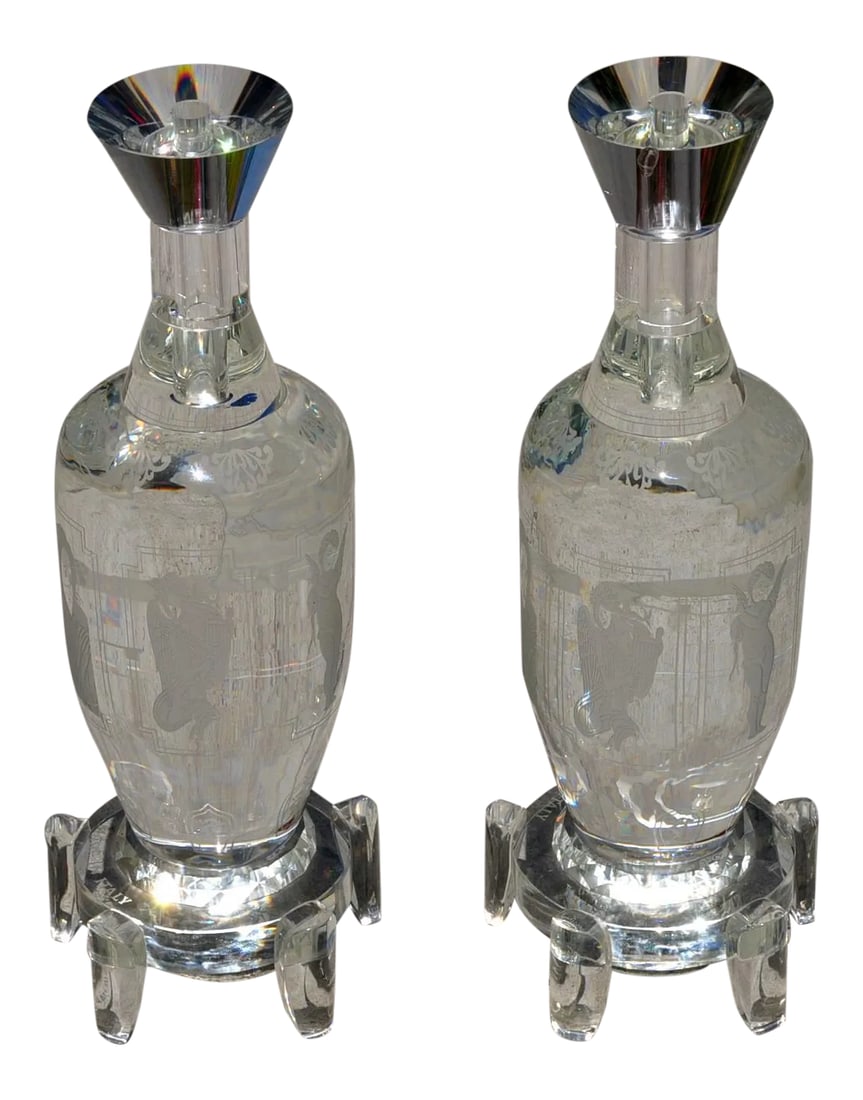 Pair of Large and Heavy Italian Solid Clear Crystal Candlesticks With Etched Art: (YOU CAN MAKE REASONABLE OFFERS.) These are a fine pair of shouldered vase form heavy clear crystal candlesticks. They have 6 different figures etched on their sides. They have stepped base with 5