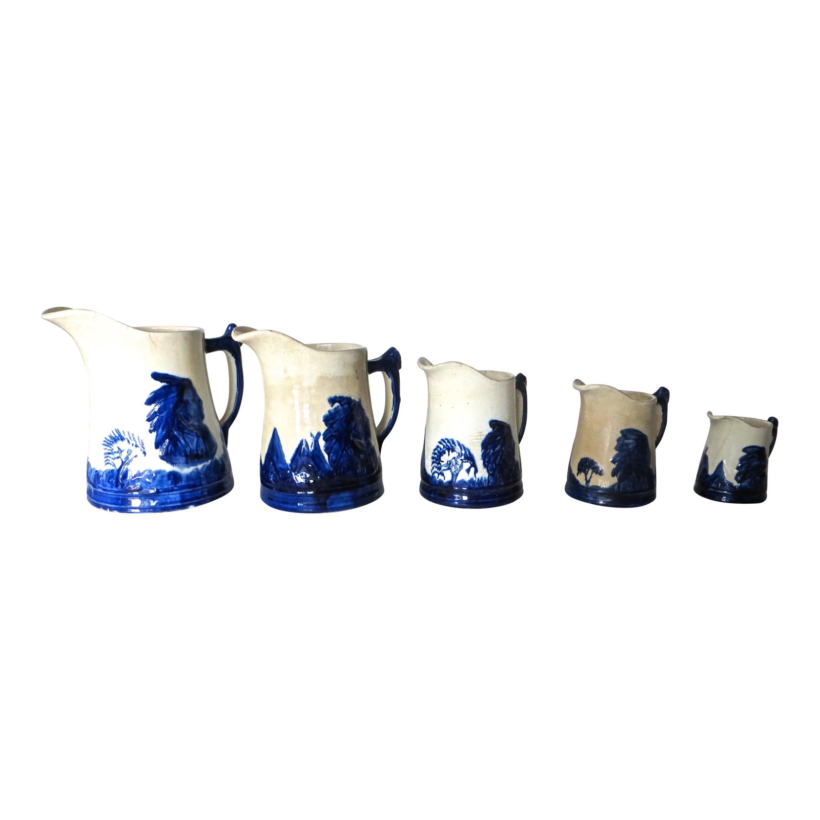 "Sleepy Eye" Complete Set of 5 Stoneware Pitchers, American, Circa 1905: "Sleepy Eye" stoneware pitchers were promotional items used to advertise The Sleepy Eye Flour Milling Company, in Sleepy Eye, Minnesota. The factory was built in 1883 and remained in operation until