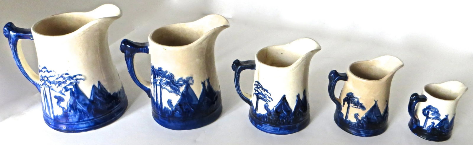"Sleepy Eye" Complete Set of 5 Stoneware Pitchers, American, Circa 1905 - 2