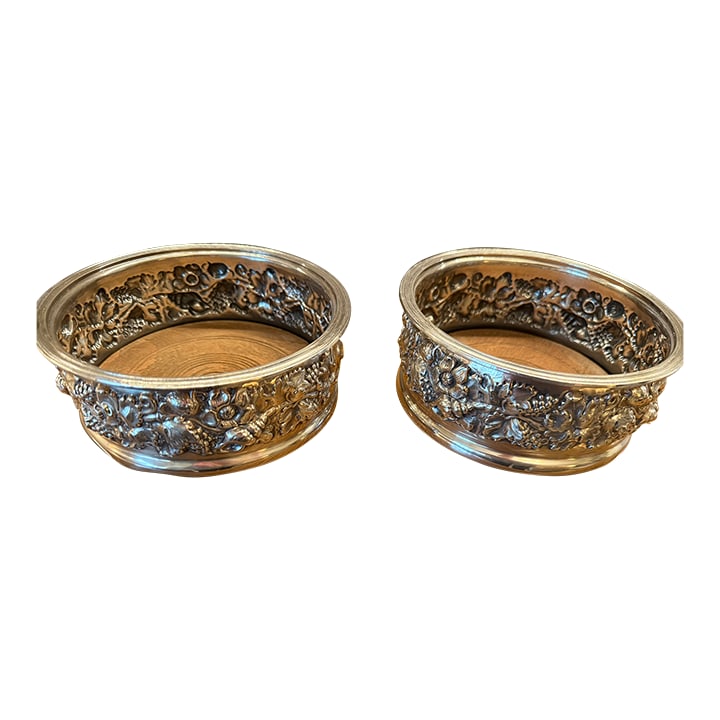 Pair of 1960s English Sterling Silver Bottle Coasters: Pair of English Sterling Silver Bottle Coasters Harrod's, Sheffield, 1968-each circular with gallery chased with grape clusters and vines Condition: Alterations: Original Condition Unaltered