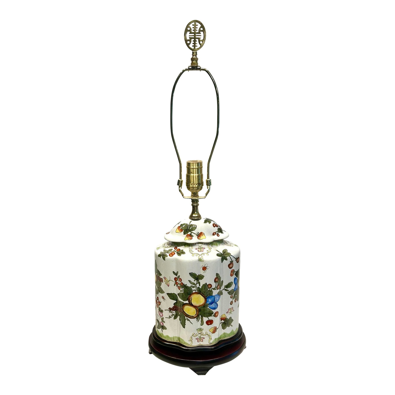 1990s Fruit Motif Asian Porcelain Lamp: This lamp features an elegant porcelain ginger-jar style body, delicately painted with fruits and butterflies among fruiting tree branches. A carved wooden base with hand applied finish provides a