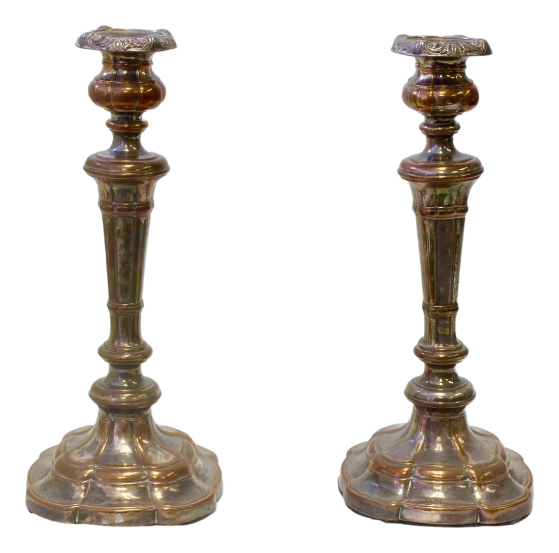 Antique English Sheffield Candlesticks- a Pair: Antique English Sheffield candlesticks featuring the classic look of antique Sheffield plate. Over the century, the silver has been polished to reveal the warm, lustrous copper base beneath, adding