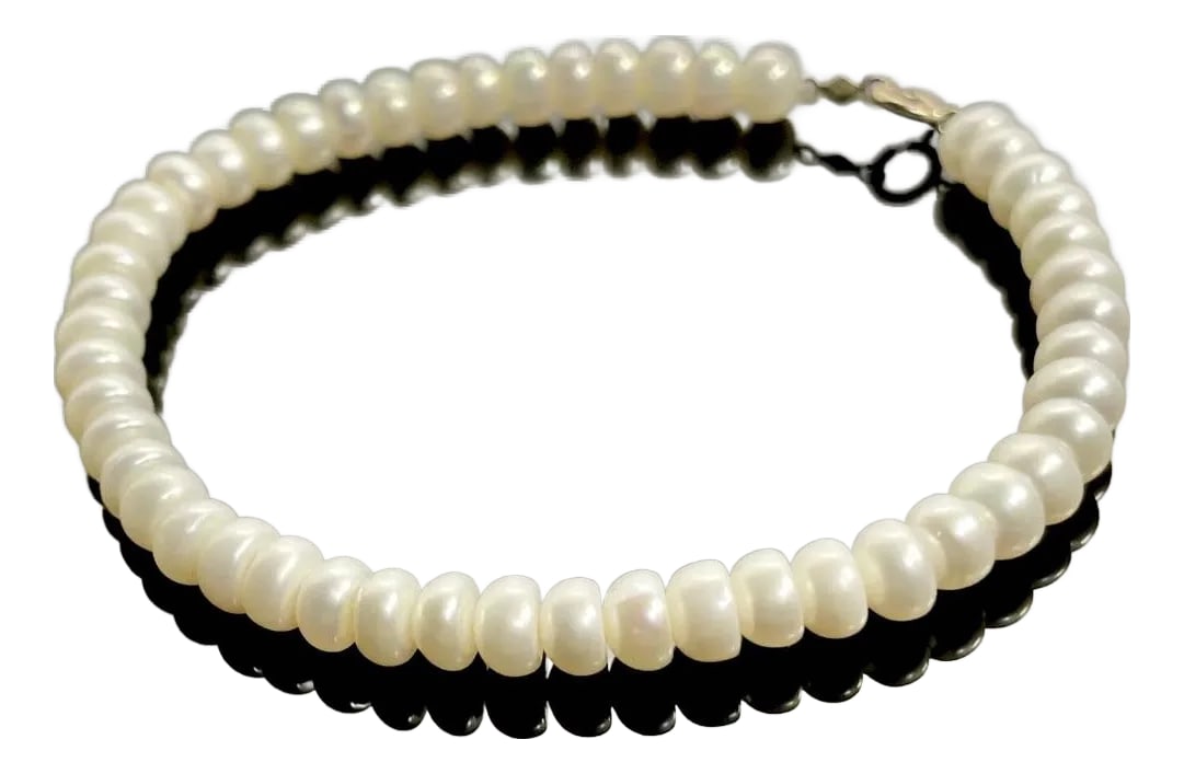 Pearl Bracelet Freshwater 10k Gold by Michael Anthony.: Freshwater pearl bracelet by Michael Anthony. Flawless and uniform ivory button pearls 4.5mm. size. The item measures 7.5" in length, with 10k gold clasp. Item is initialed Ma, for designer Michael An