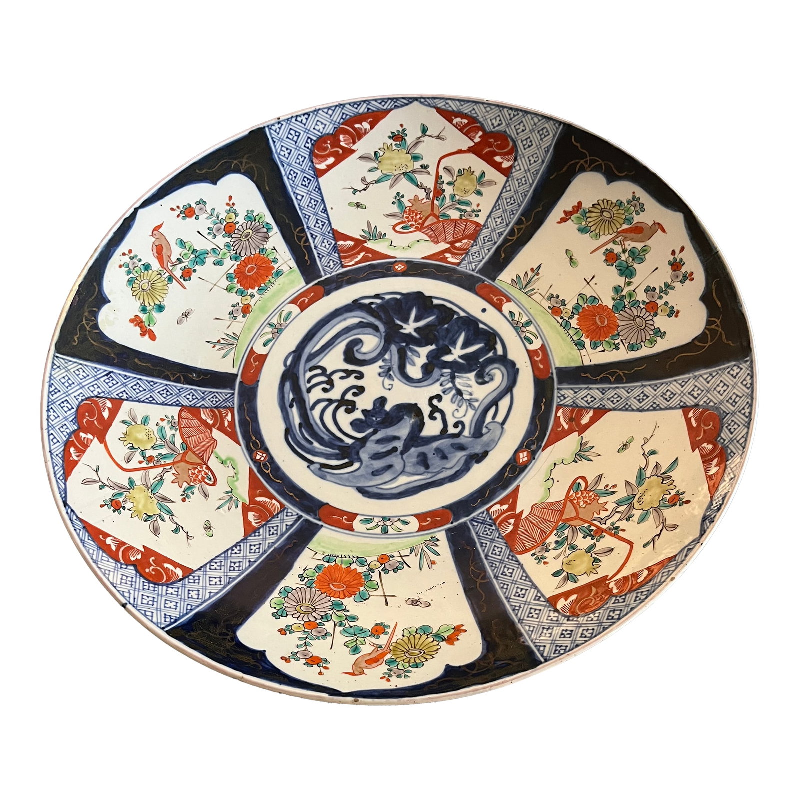 19th Century Meiji Era Large Japanese Imari Charger: Truly stunning 19th century Meiji Era Japanese Imari plate. This plates measures 18" in diameter with rich hues of blue and red hand painted throughout and traces of gold leafing. Condition: