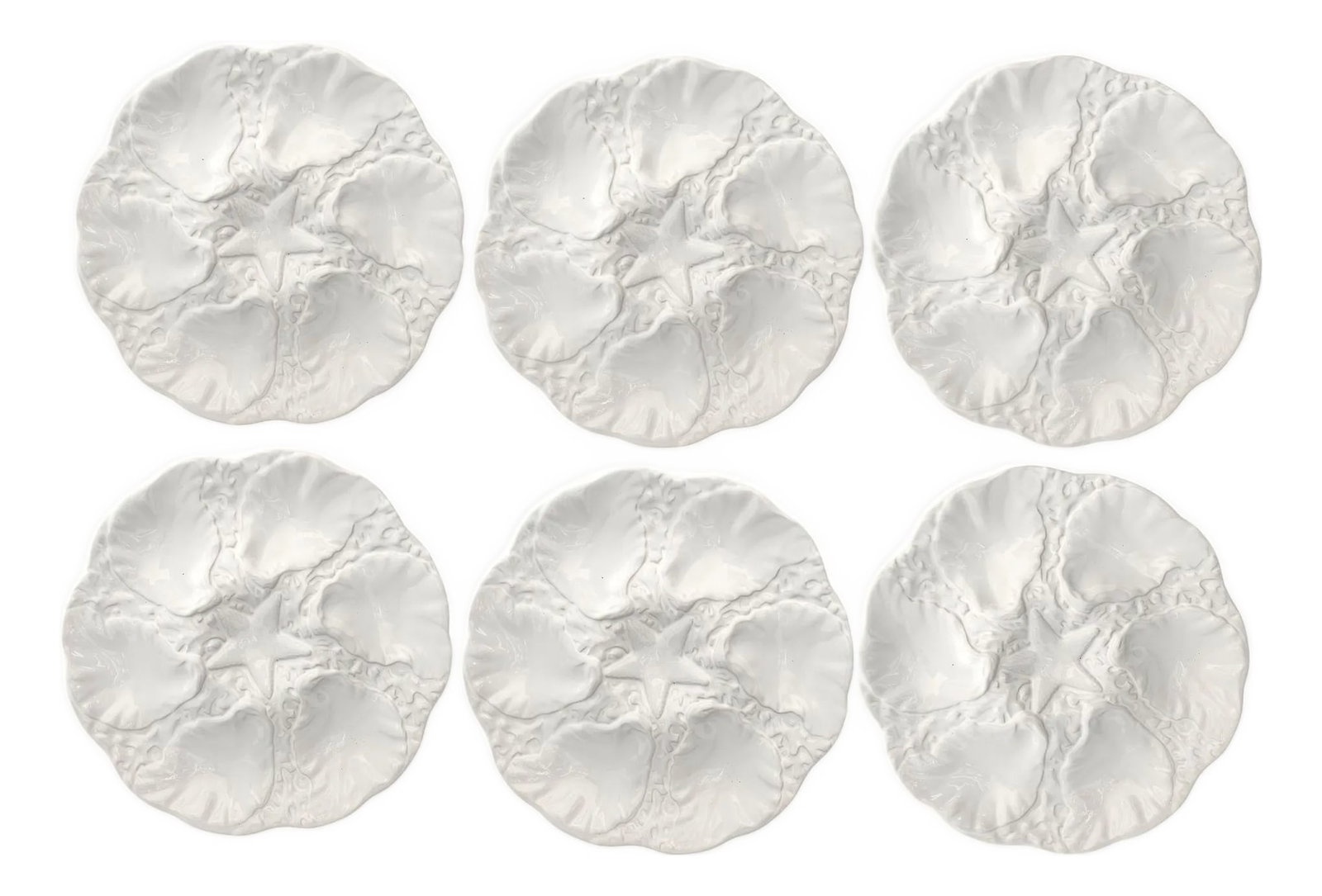 Midcentury Majolica Starfish Oyster Plates - Set of 6: Mid-century entertaining never looked so chic. This set of six white majolica oyster plates by Bordallo Pinheiro (Caldas da Rainha, Portugal) features six sculpted oyster wells circling a central star