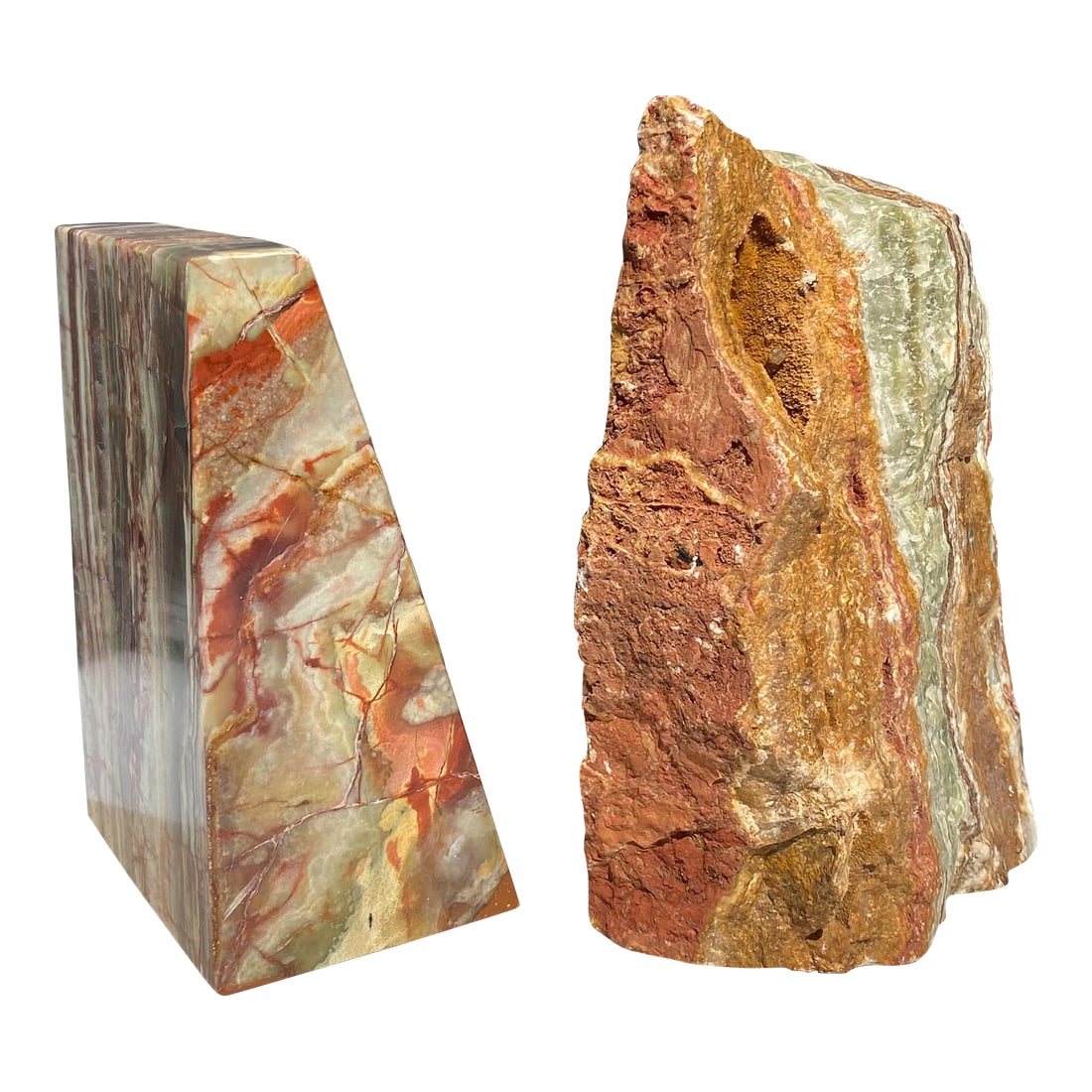 1970s Pair of Carved Onyx Stone Bookends: Unique pair of onyx marble bookends made from ornamental stone mined from the Baluchistan region of Pakistan. One bookend is completely carved into a classic geometric triangle shape, while the other 