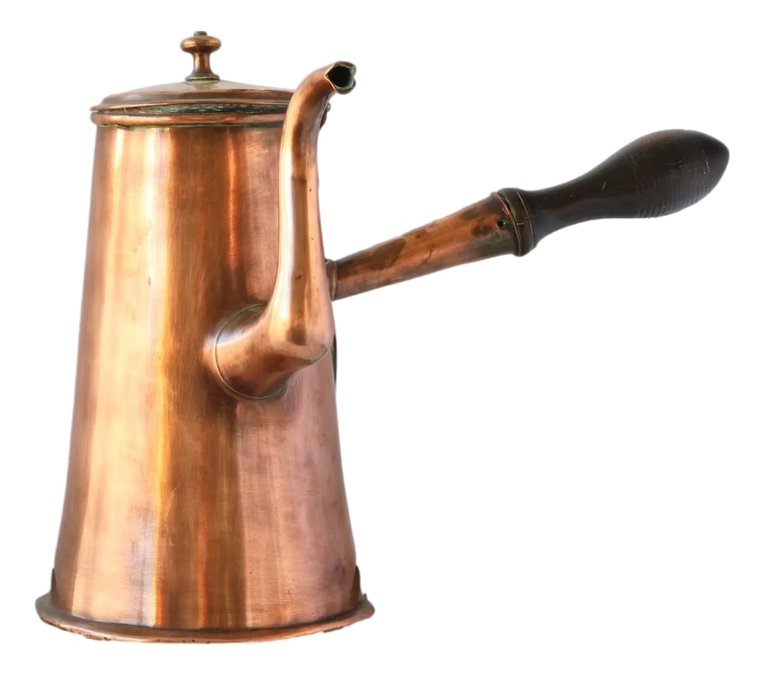 Antique English Copper Chocolate Pot: Early 19th-century English copper chocolate pot featuring dovetailed seams-a hallmark of age and early craftsmanship-along with its original lid and turned wood handle. This elegant vessel was