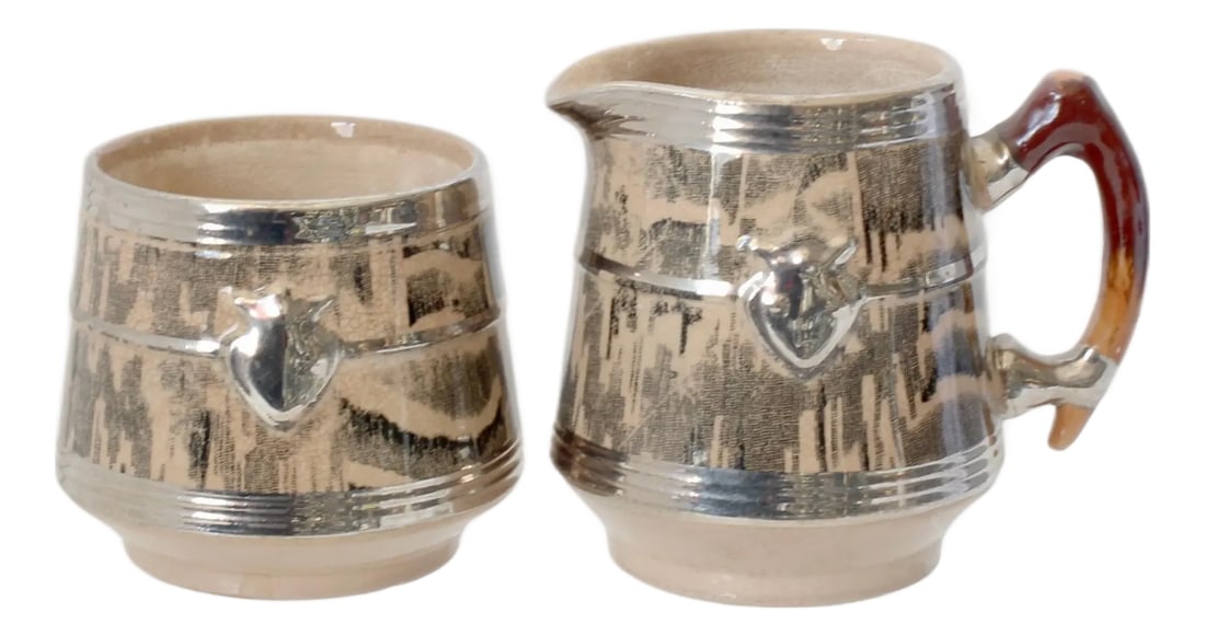 1930s Silver Shield Faux Bois Pattern Cream & Sugar: This distinctive Arthur Wood Silver Shield cream & sugar embodies the artistry of English pottery. Featuring a faux-bois pattern that mimics the look of wood, the shields and accents are crafted