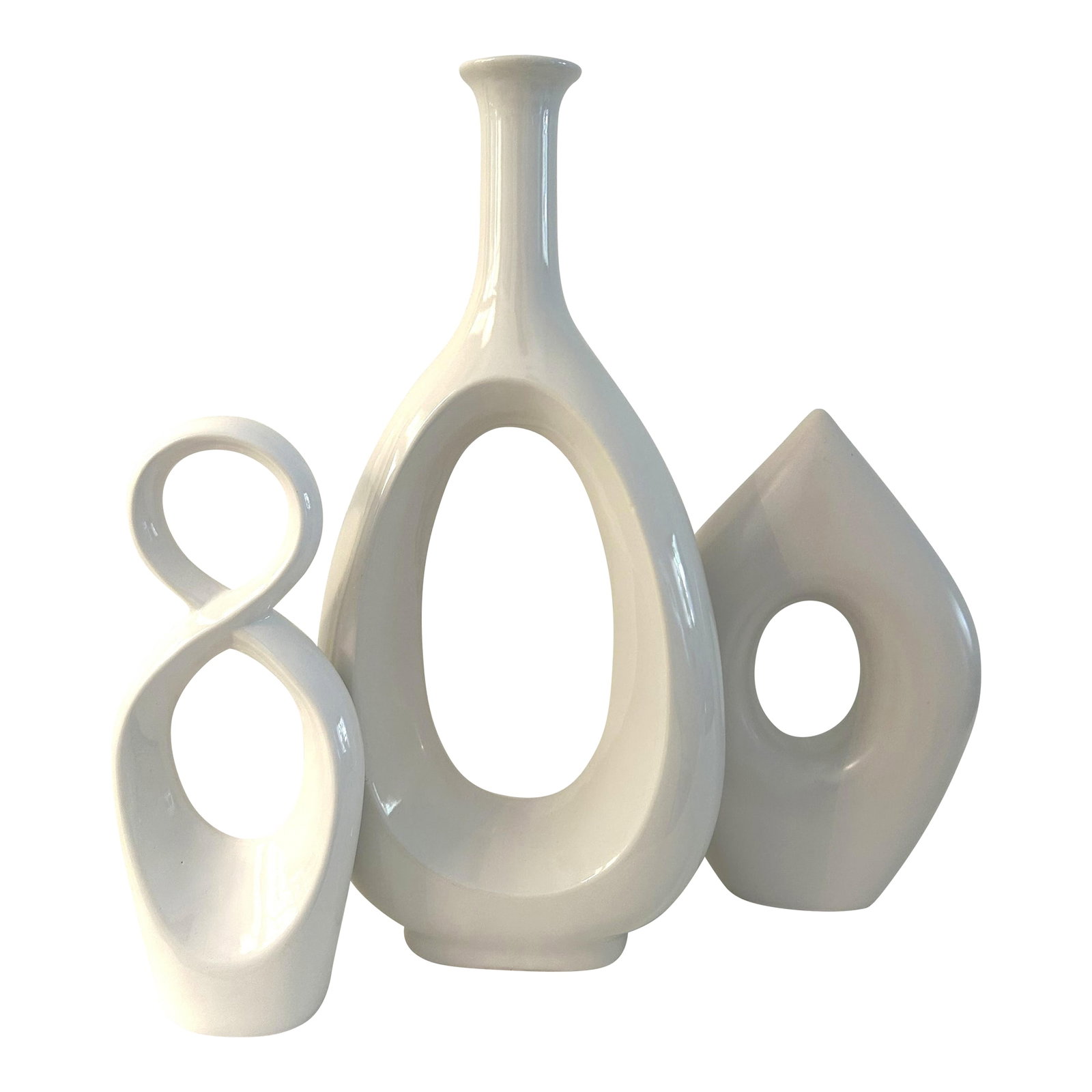 Organic Modern White Cermaic Sculptures, Set of 3: Contemporary set of three organic modern design white ceramic sculptures each in a different design. Excellent condition. Dimensions: tall sculpture, 19.25"H x 8.25"L x 4"W; double circle sculpture,