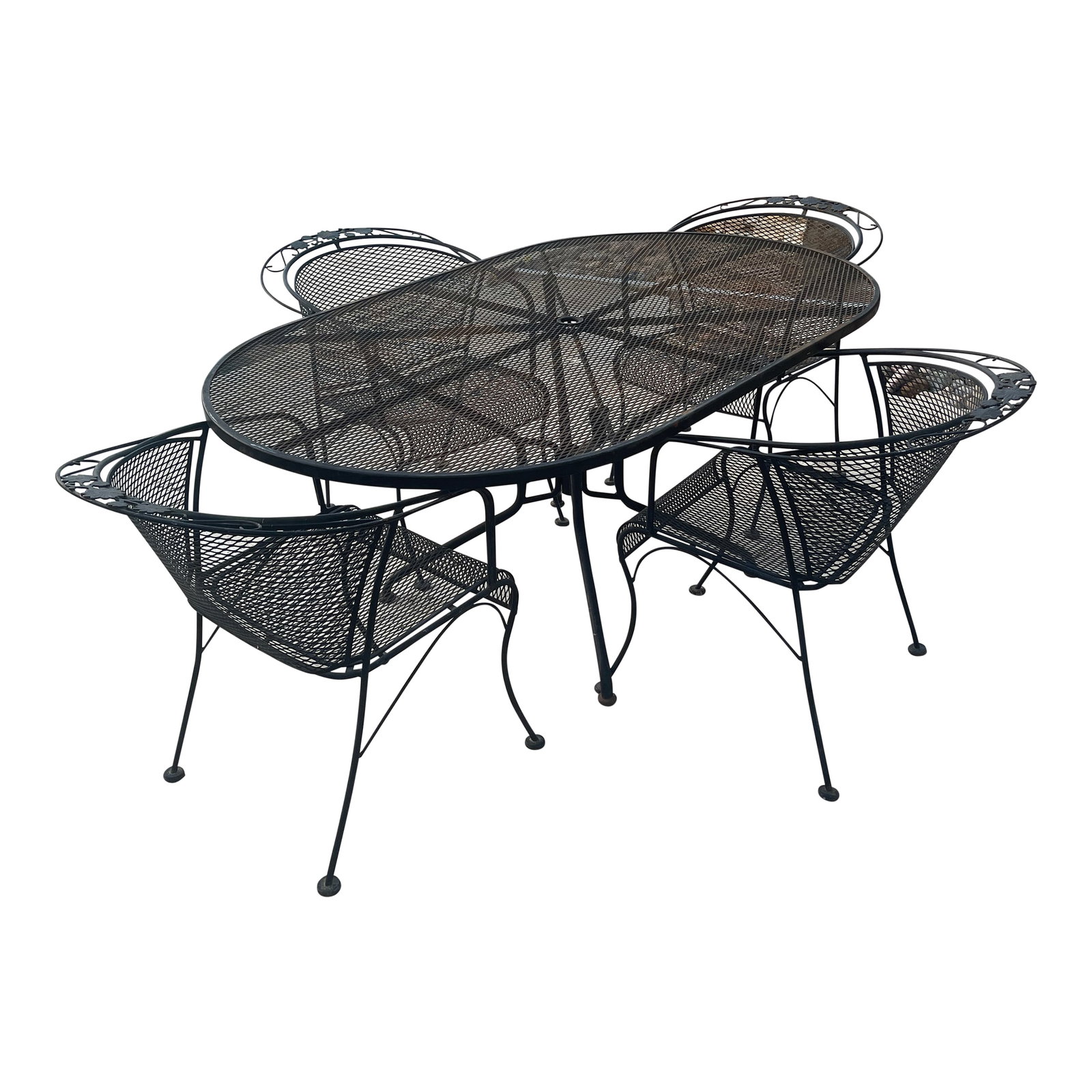 Mid-Century Modern Black Russell Woodard Wrought Iron Outdoor Patio Dinning Set Oval Table and 4 Bar: Classic mid-century style meets outdoor durability with this vintage wrought iron patio dining set. The set includes an oval mesh-top table and four matching armchairs, all crafted from sturdy