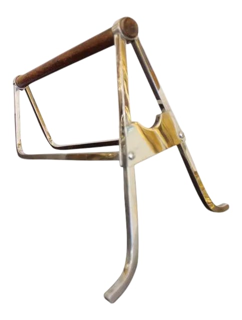 1930s Jacques Adnet Modernist Design Barware Wine Pourer: A modernist wine bottle holder made of chromed metal, with a beautiful rosewood handle. The square section rods are a genuine Adnet specificity. This piece has been attributed based on archival