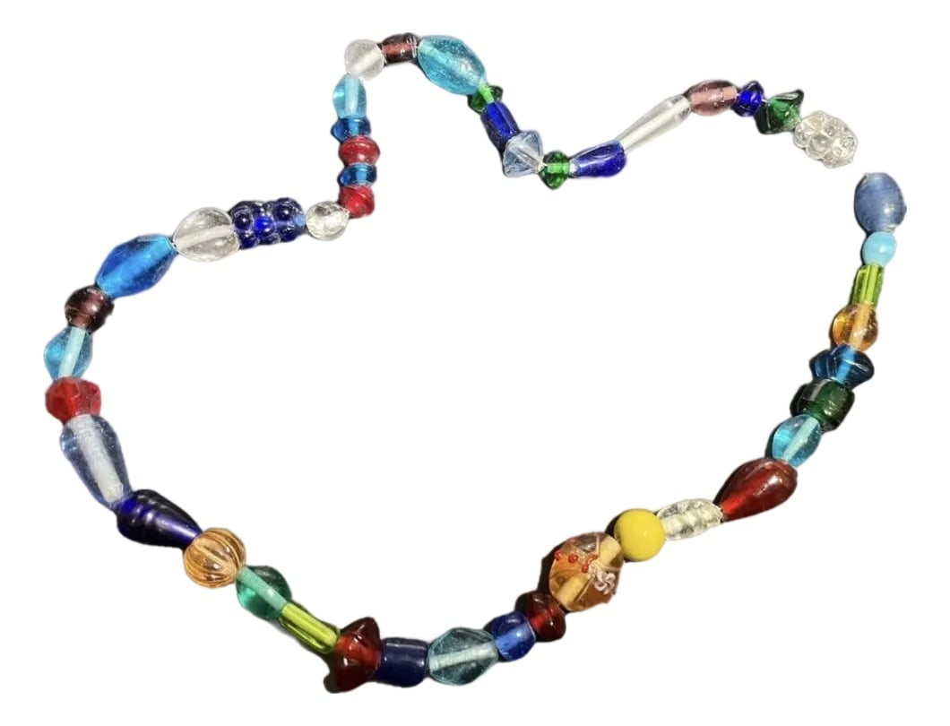 Bohemian Glass From Jablonec Nad Nisou (Formerly Gablonz) Pressed Glass Bead Necklace in Various Col: pressed glass bead necklace crafted from glass beads formed by squeezing molten glass rods into custom metal dies or molds. Pioneered in 19th-century Northern Bohemia. Necklace has many shapes and