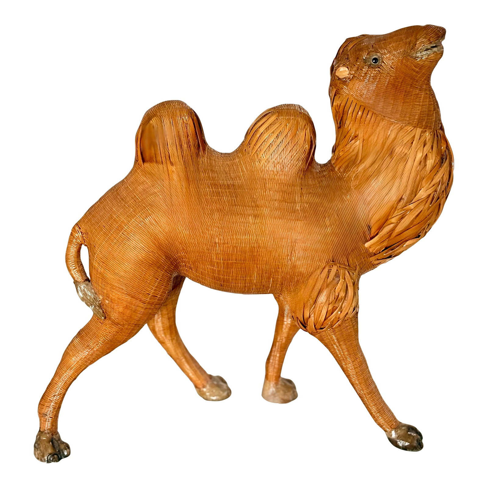 Mid-Century Chinese Wicker and Reed Camel: This extraordinary mid-twentieth century wicker camel is expertly crafted with an ambitious woven construction that translates a joyous expression and posture. This stunning piece is in excellent